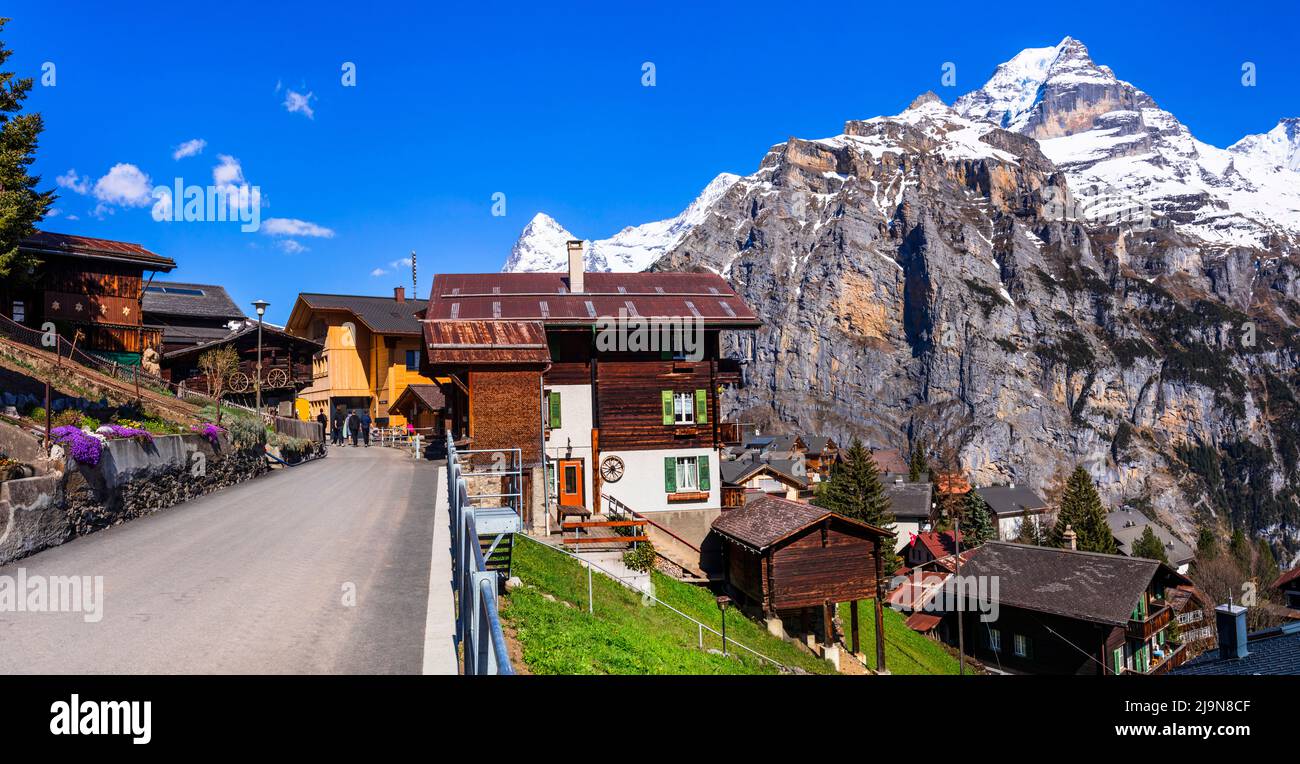 Switzerland nature and travel. Alpine scenery. Scenic traditional mountain village Murren surrounded by snow peaks of Alps. Popular tourist destinatio Stock Photo