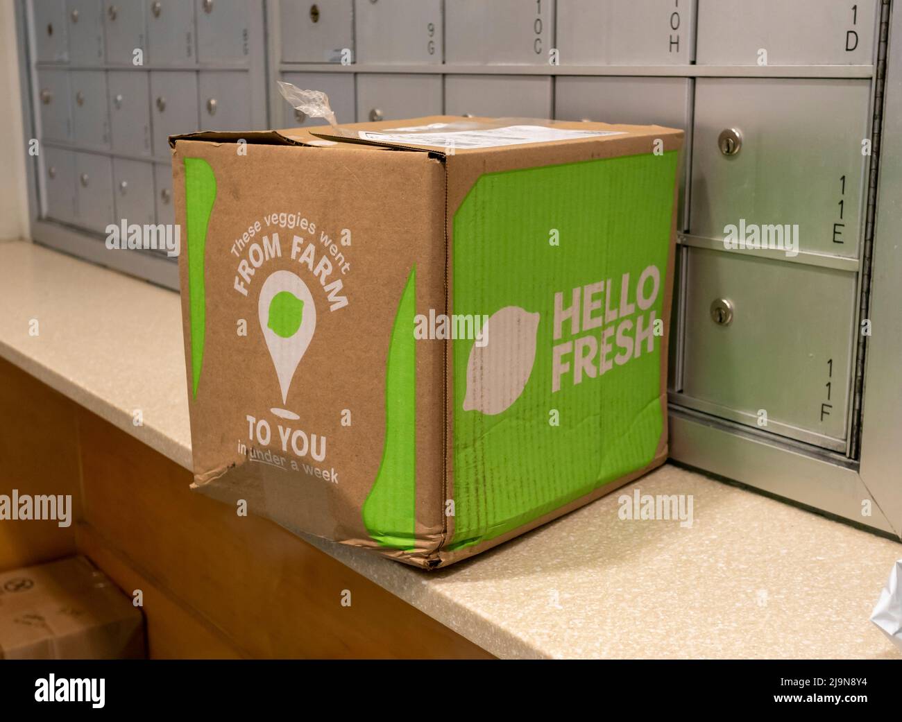 A distressed delivery from the Hello Fresh meal subscription service waits to be picked up in the lobby of an apartment building in New York on Monday, May 16, 2022. (© Richard B. Levine) Stock Photo