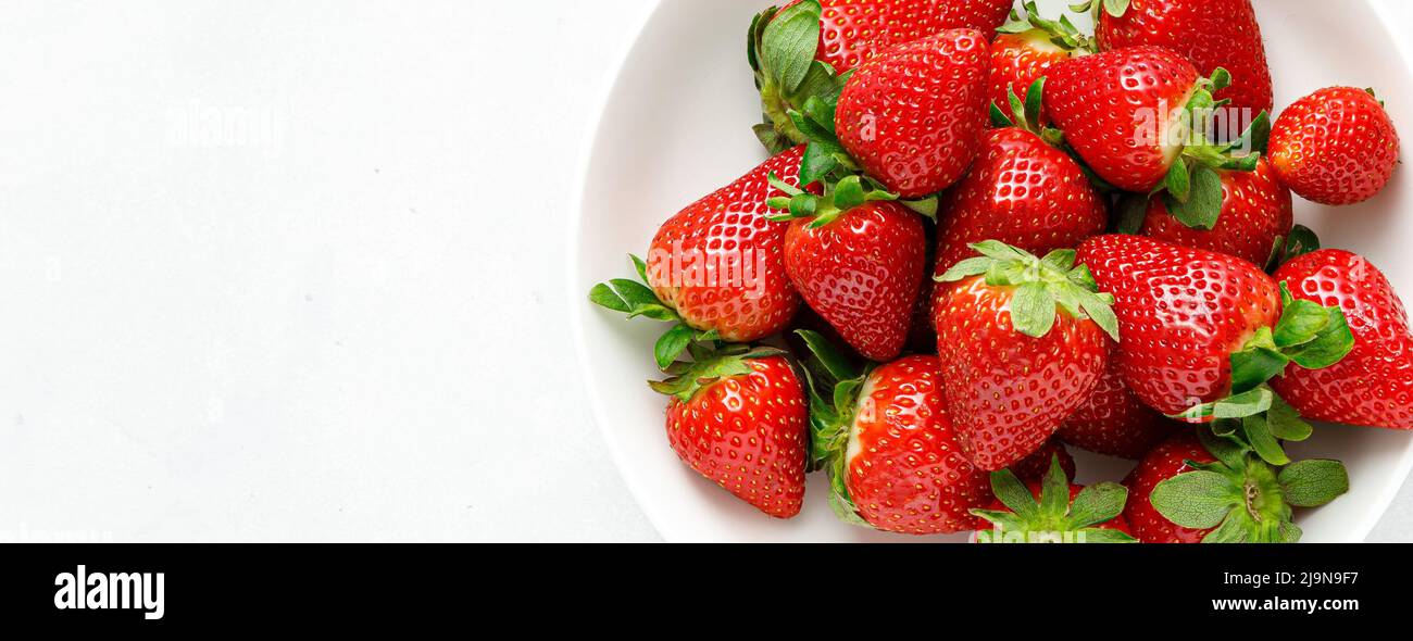 Strawberry on white background. Top view. Banner. Stock Photo