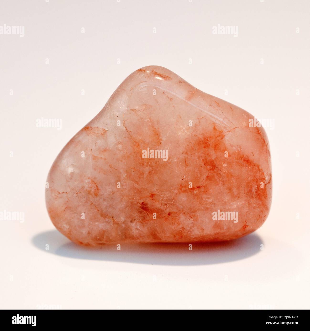 Macro shot a close up colour photograph of a polished  'Morganite' a semi precious crystal healing stone Stock Photo