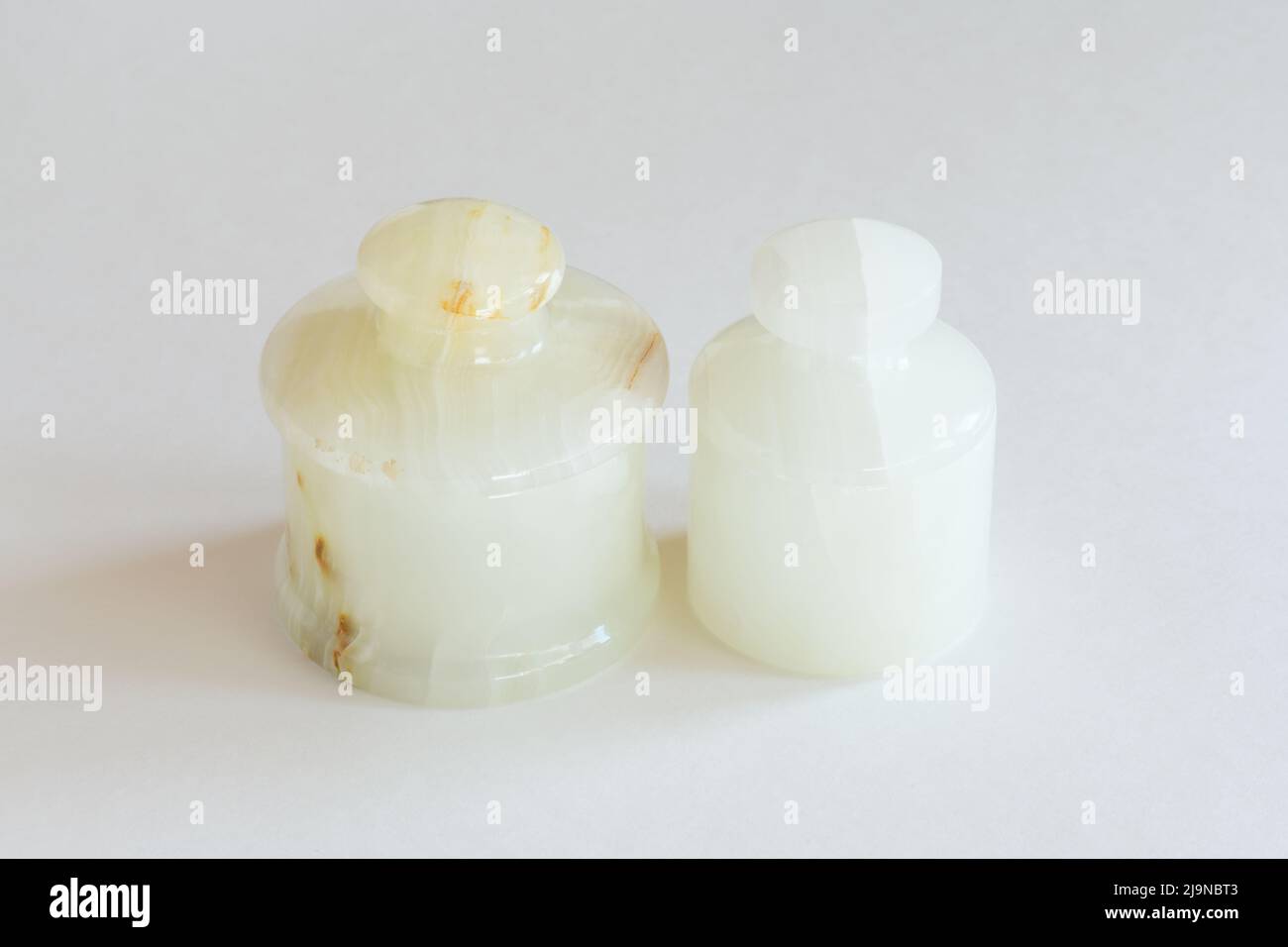 Two round onyx boxes mock up on white background. Stock Photo