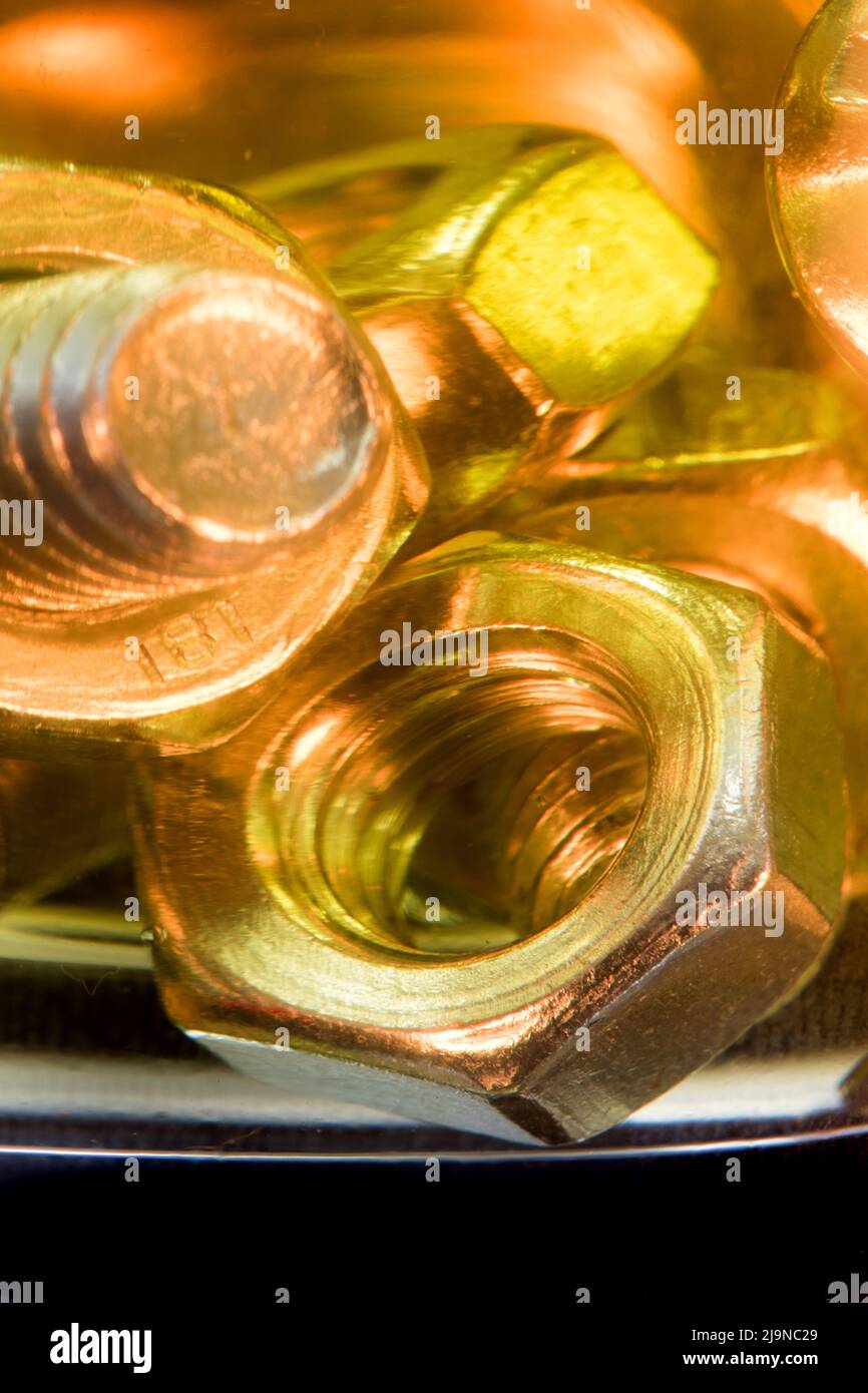 Metallic nuts and bolts in lubrication oil Stock Photo Alamy