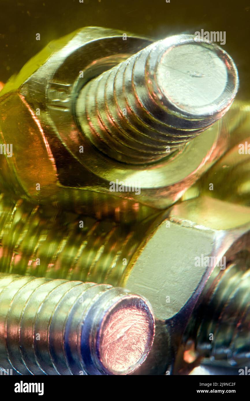 Metallic nuts and bolts in lubrication oil Stock Photo Alamy