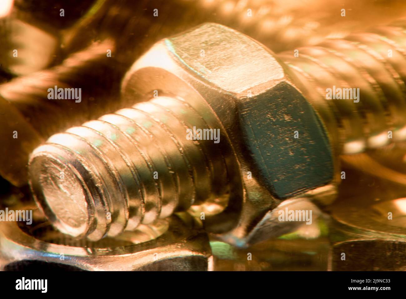Metallic nuts and bolts in lubrication oil Stock Photo Alamy