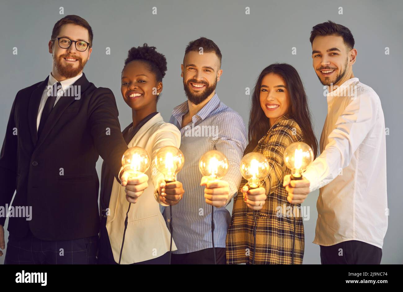 Group smiling people holding hi-res stock photography and images - Alamy