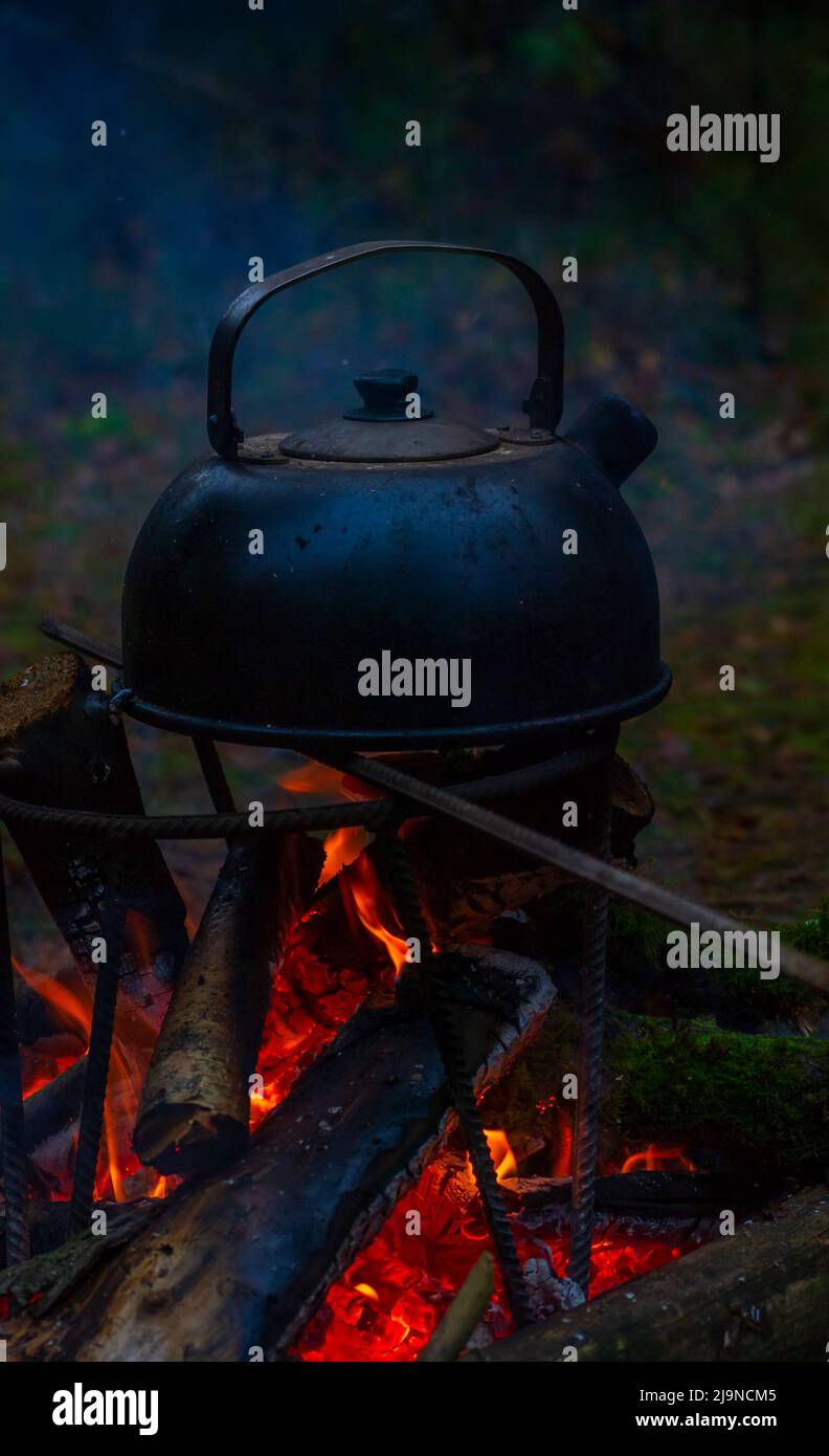an old camping kettle is heated on a fire Stock Photo - Alamy