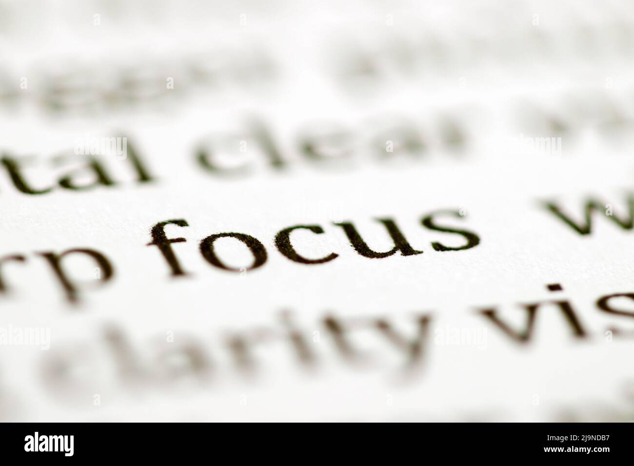 Close up of the typed word focus printed in black ink on white ink jet paper Stock Photo