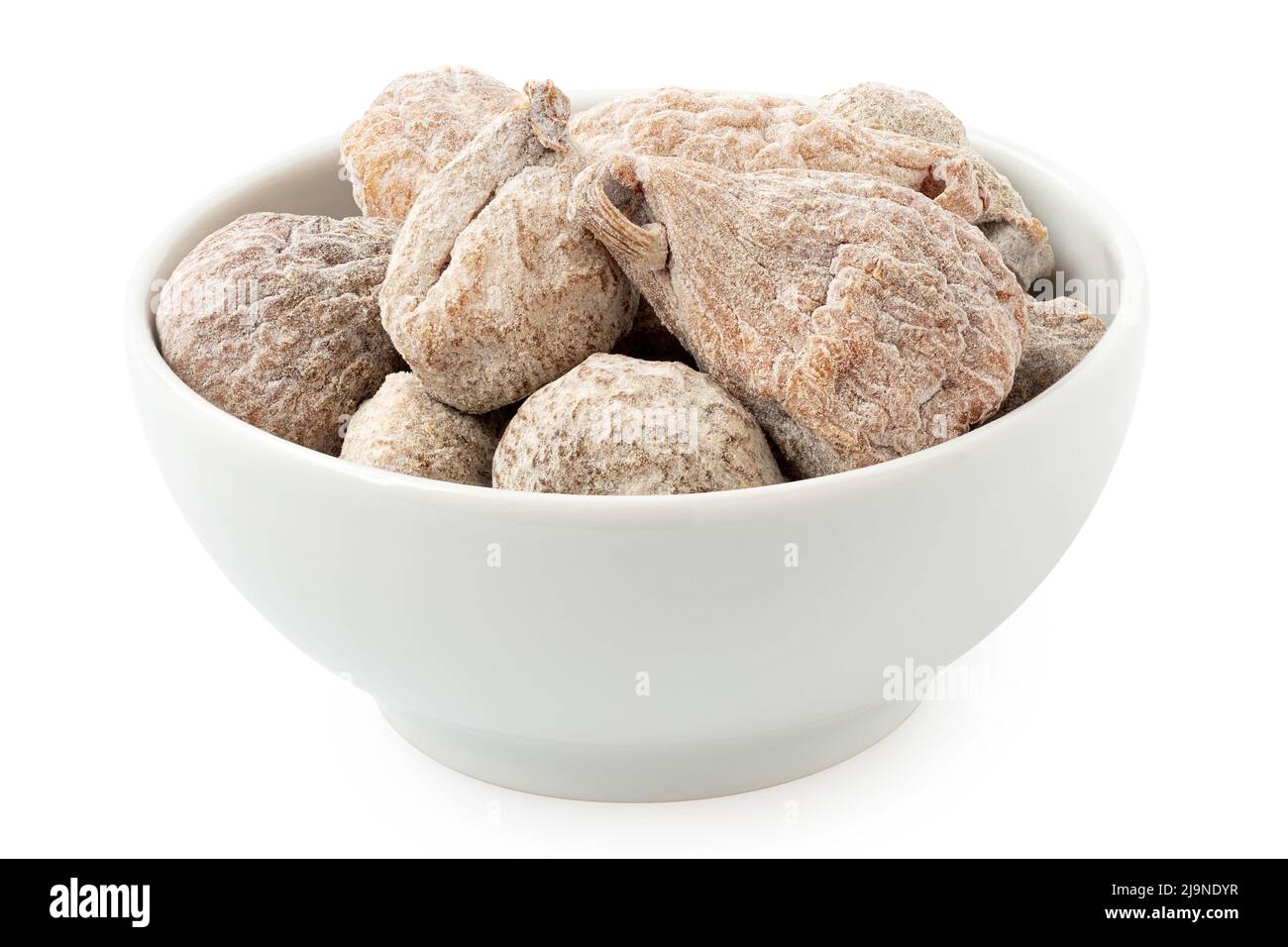Dusted dried baby figs in a white ceramic bowl isolated on white. Stock Photo