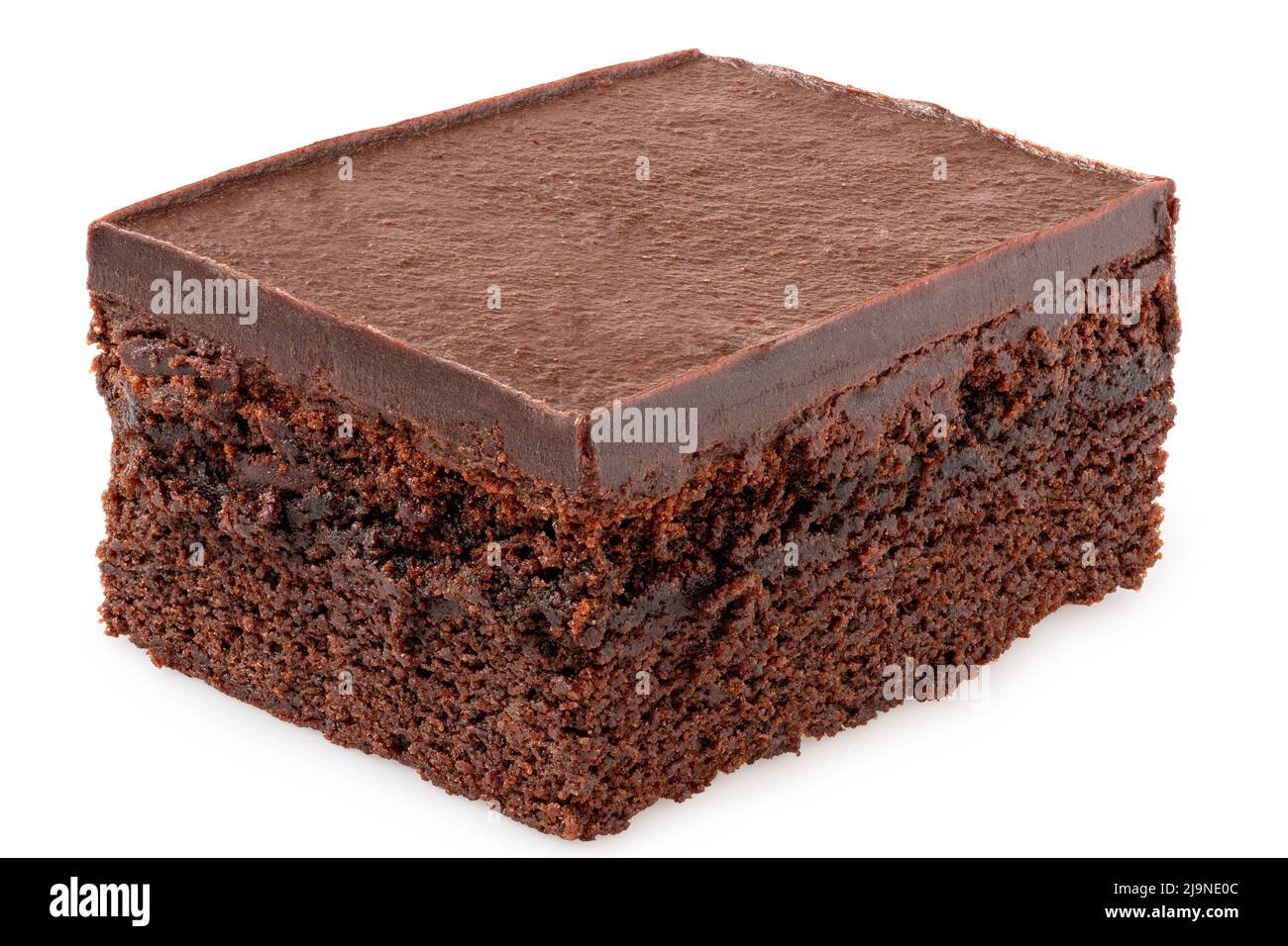 Chocolate cake square with chocolate icing isolated on white. Stock Photo