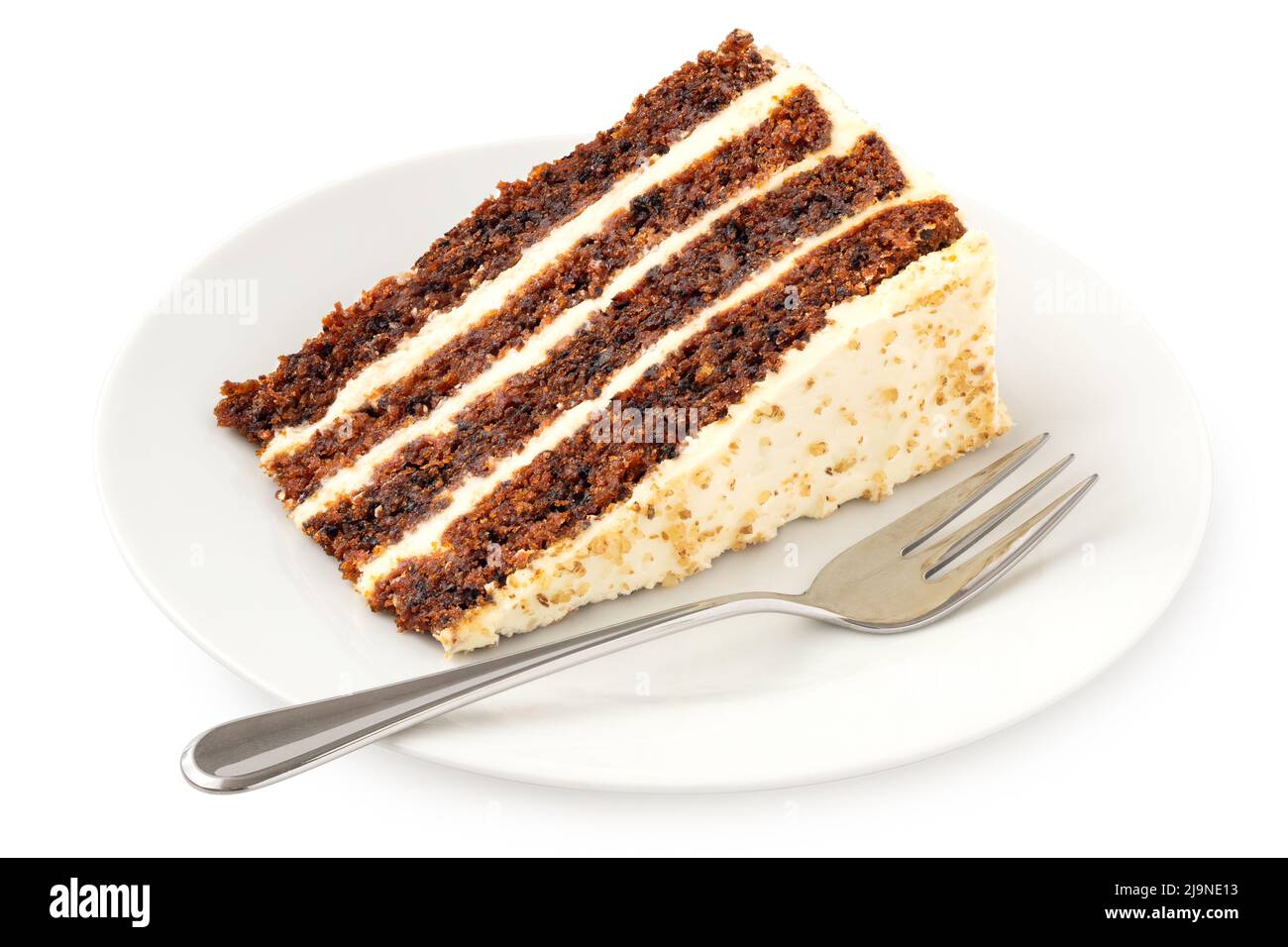 Slice of carrot cake with cream cheese filling and frosting on white plate with fork isolated on white. Stock Photo