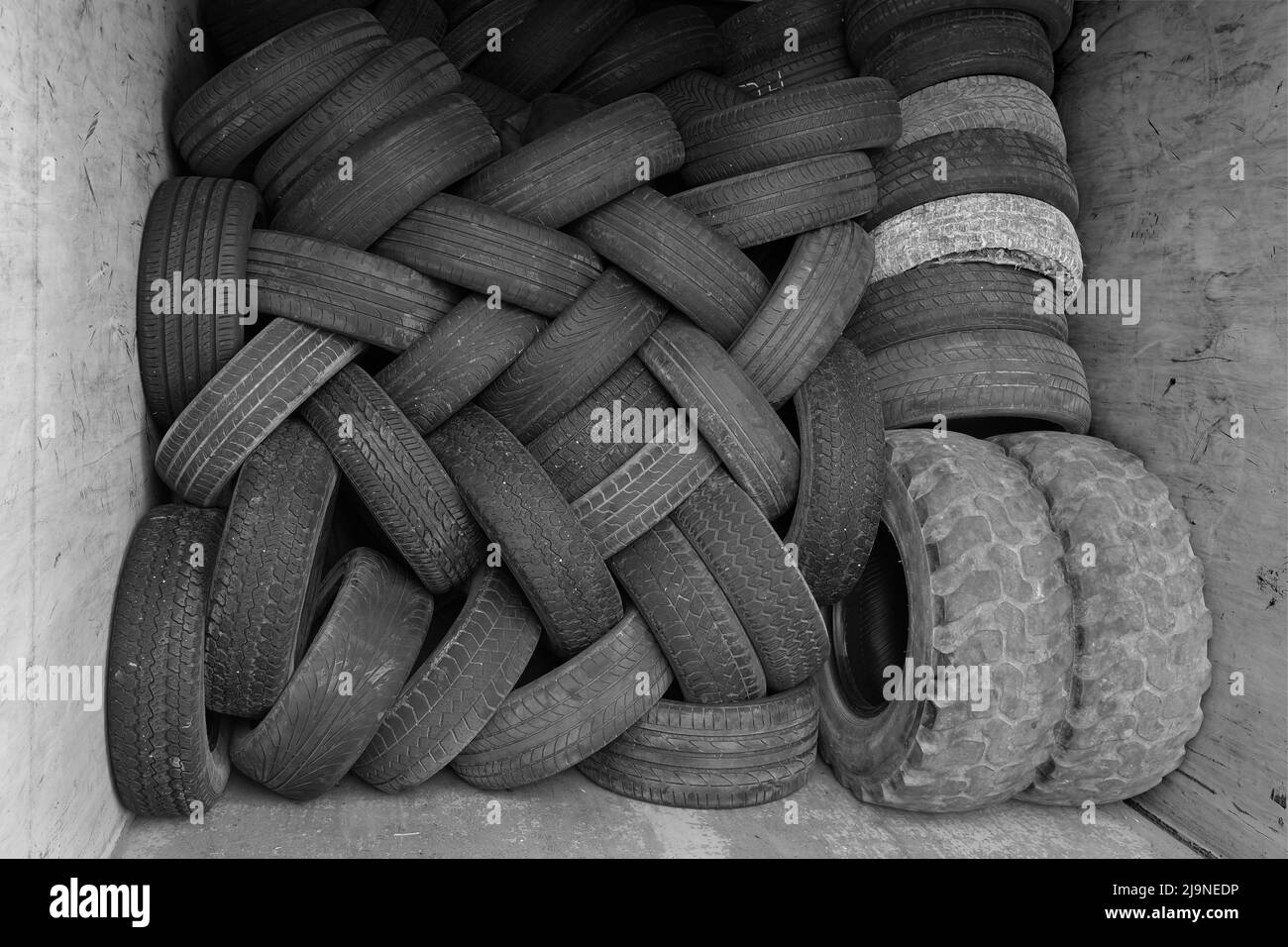 a mixture of old tyres stacked and stapled together Stock Photo