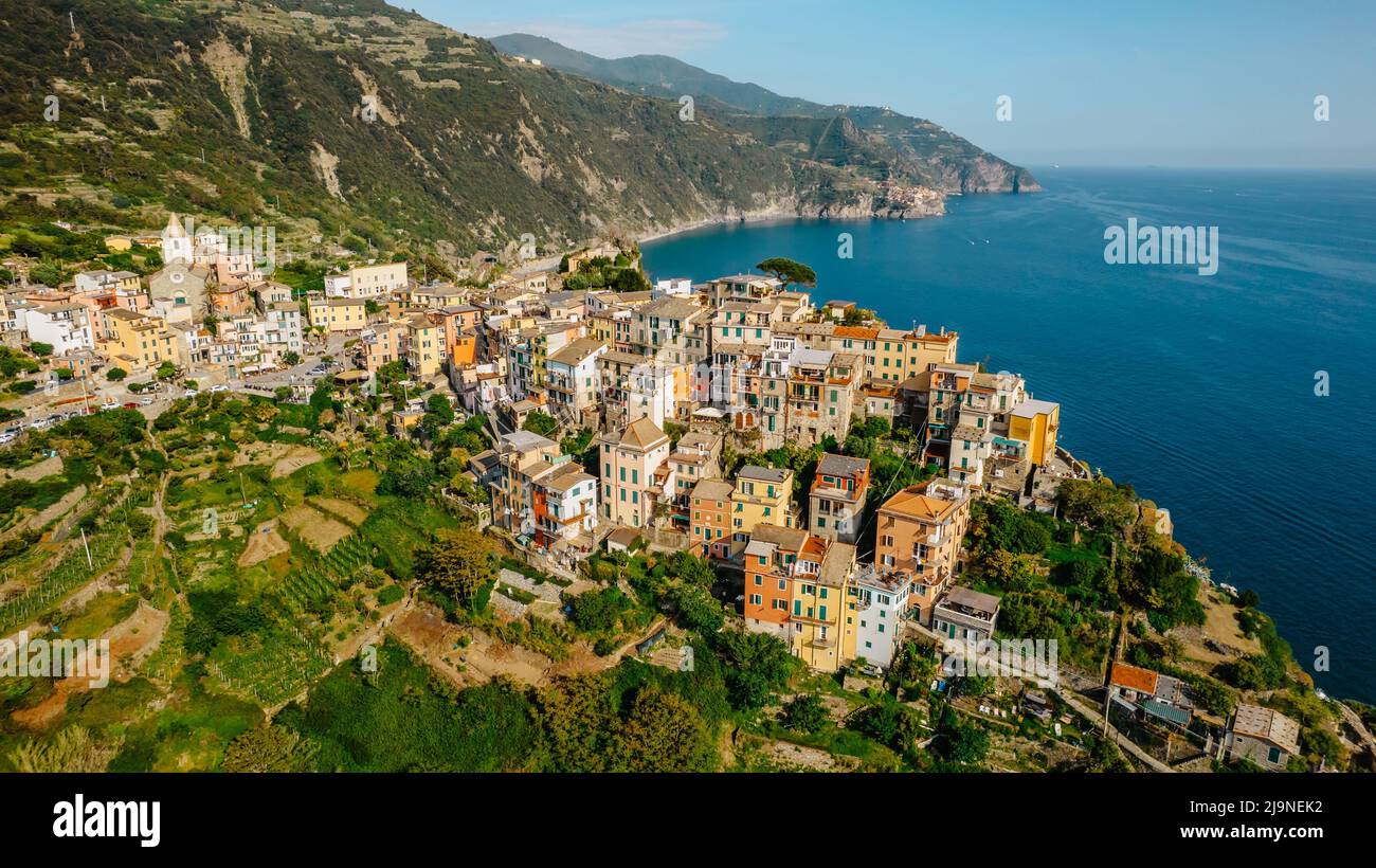 Aerial view of Corniglia and coastline of Cinque Terre,Italy.UNESCO Heritage Site.Picturesque colorful village on rock above sea.Summer holiday,travel Stock Photo