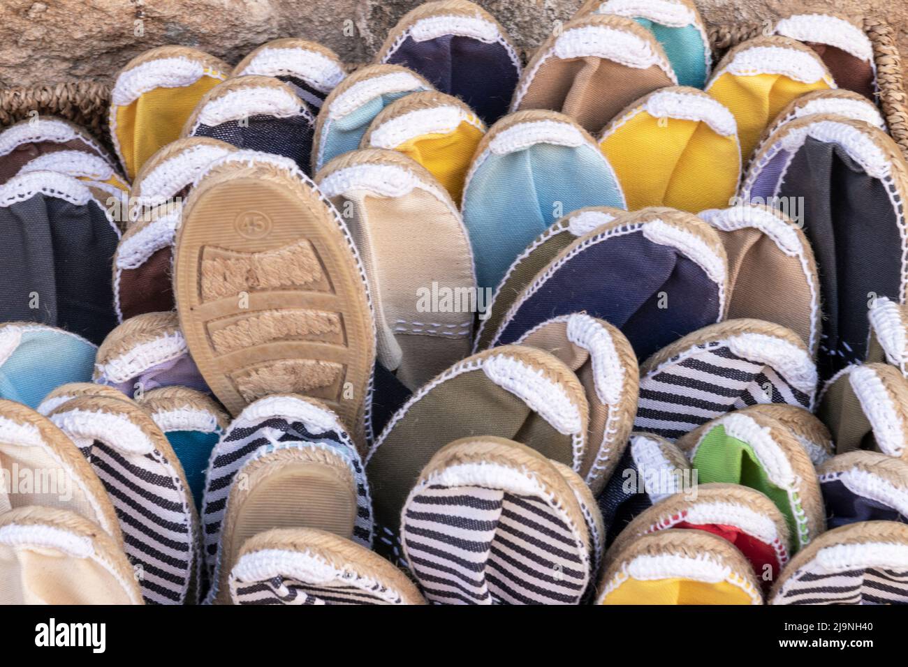 Stack of shoes at market stall hi-res stock photography and images - Alamy