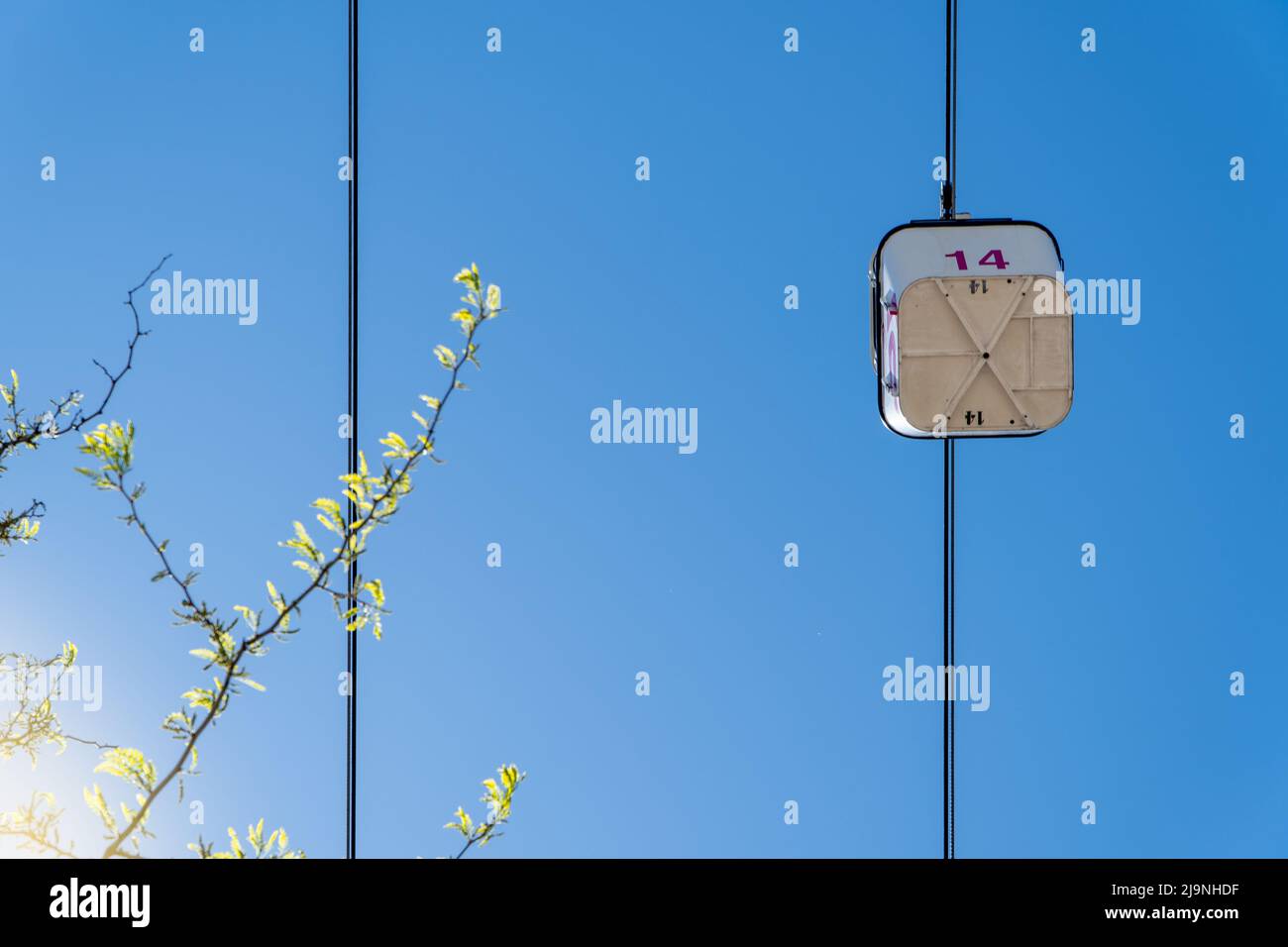 cable car cabin on blue sky background seen from below Stock Photo - Alamy