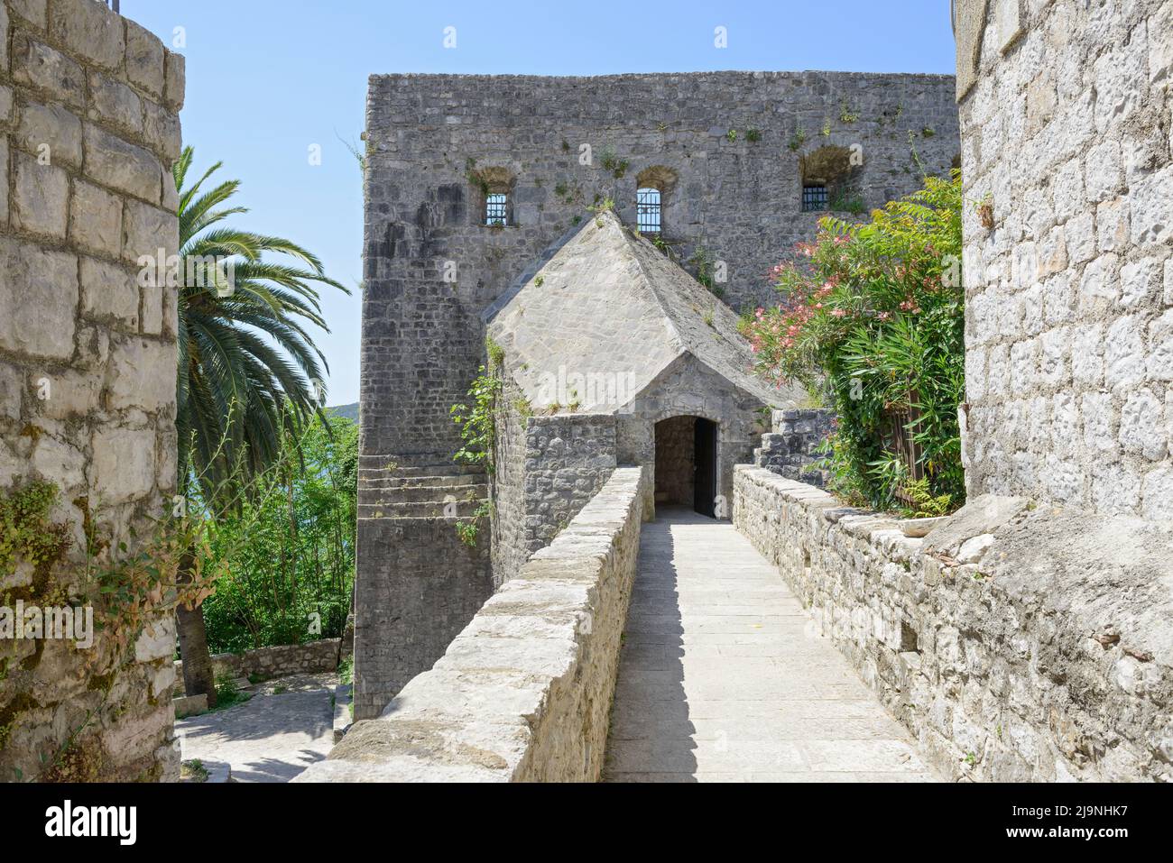 View along Marka Vojnovića street towards entrance to fortress Forte Mare in Herceg Novi, Montenegro. Stock Photo