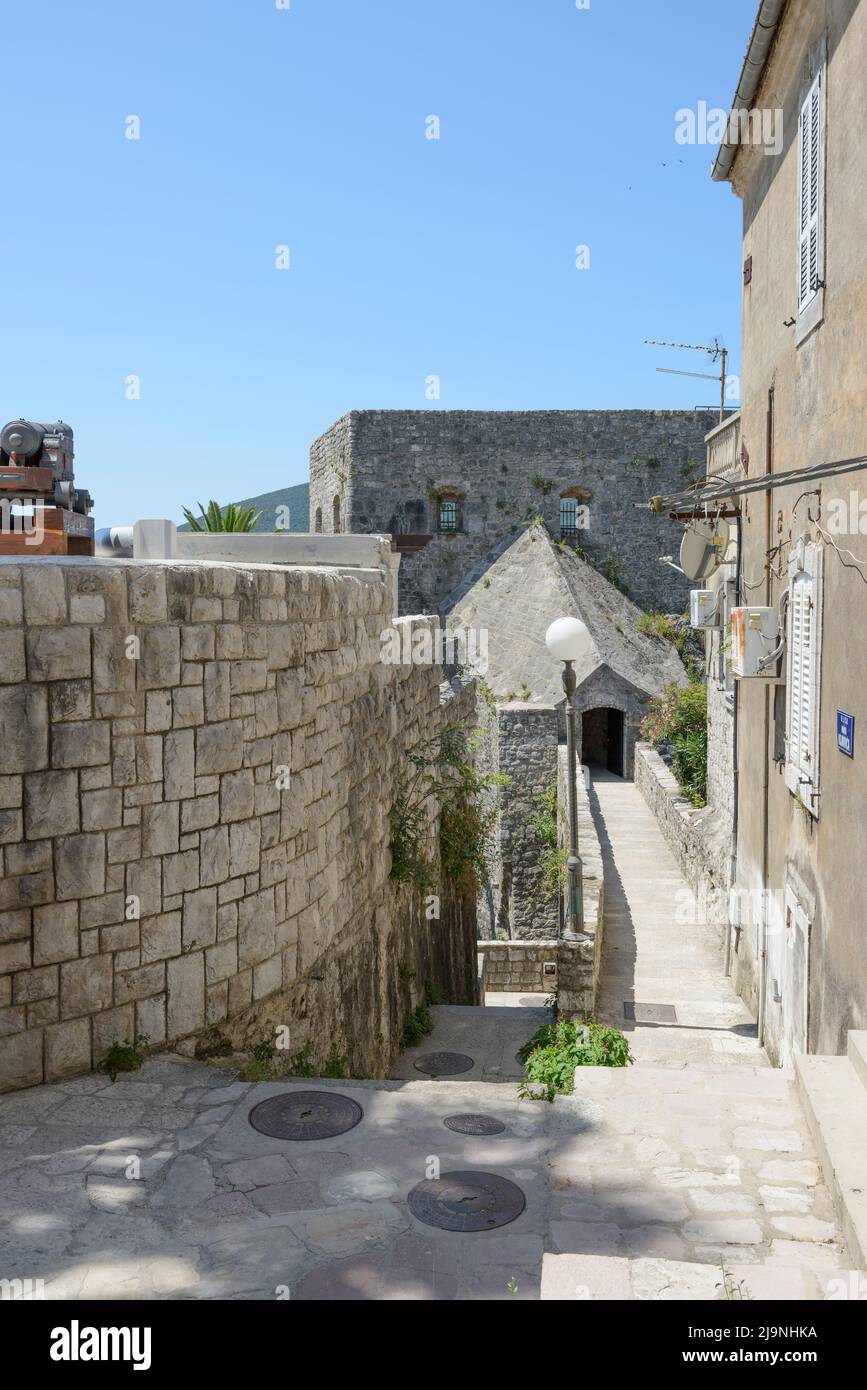 View along Marka Vojnovića street towards entrance to fortress Forte Mare in Herceg Novi, Montenegro. Stock Photo