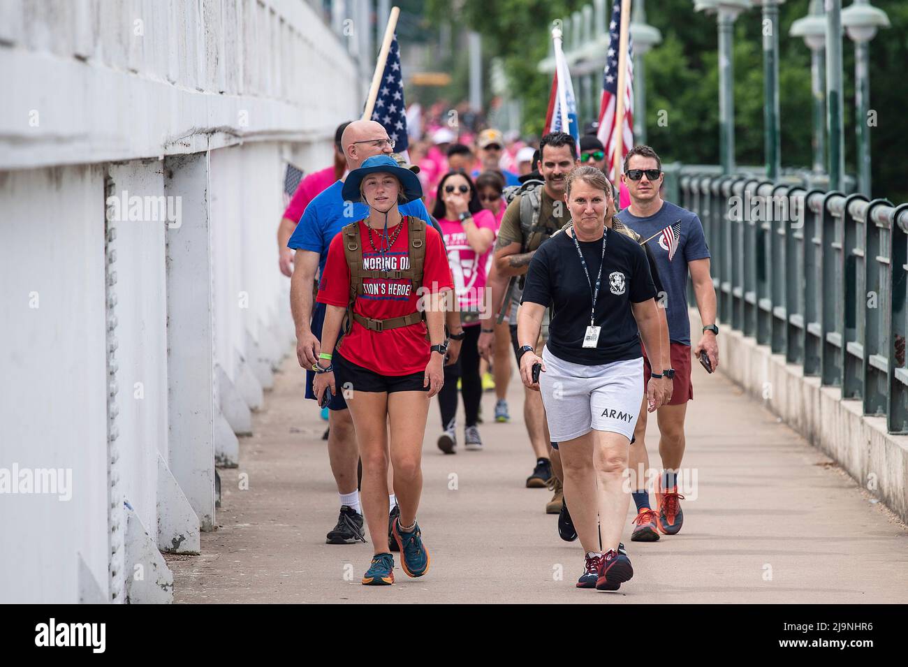 Republic Square Park. 24th May, 2022. Jessica kessel (Left) leading Carry The Load West Coast Route of the 2022 National Relay crossing Lady Bird Lake to Rally and honor the sacrifices of our nationÕs heroes at Republic Square Park. Austin, Texas. Mario Cantu/CSM/Alamy Live News Stock Photo