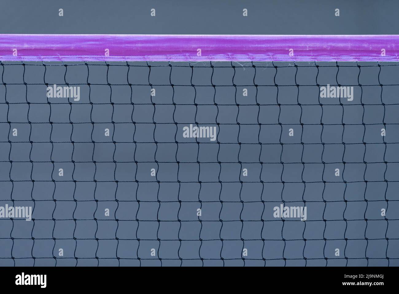 Beach volleyball and beach tennis net on dark background. Horizontal