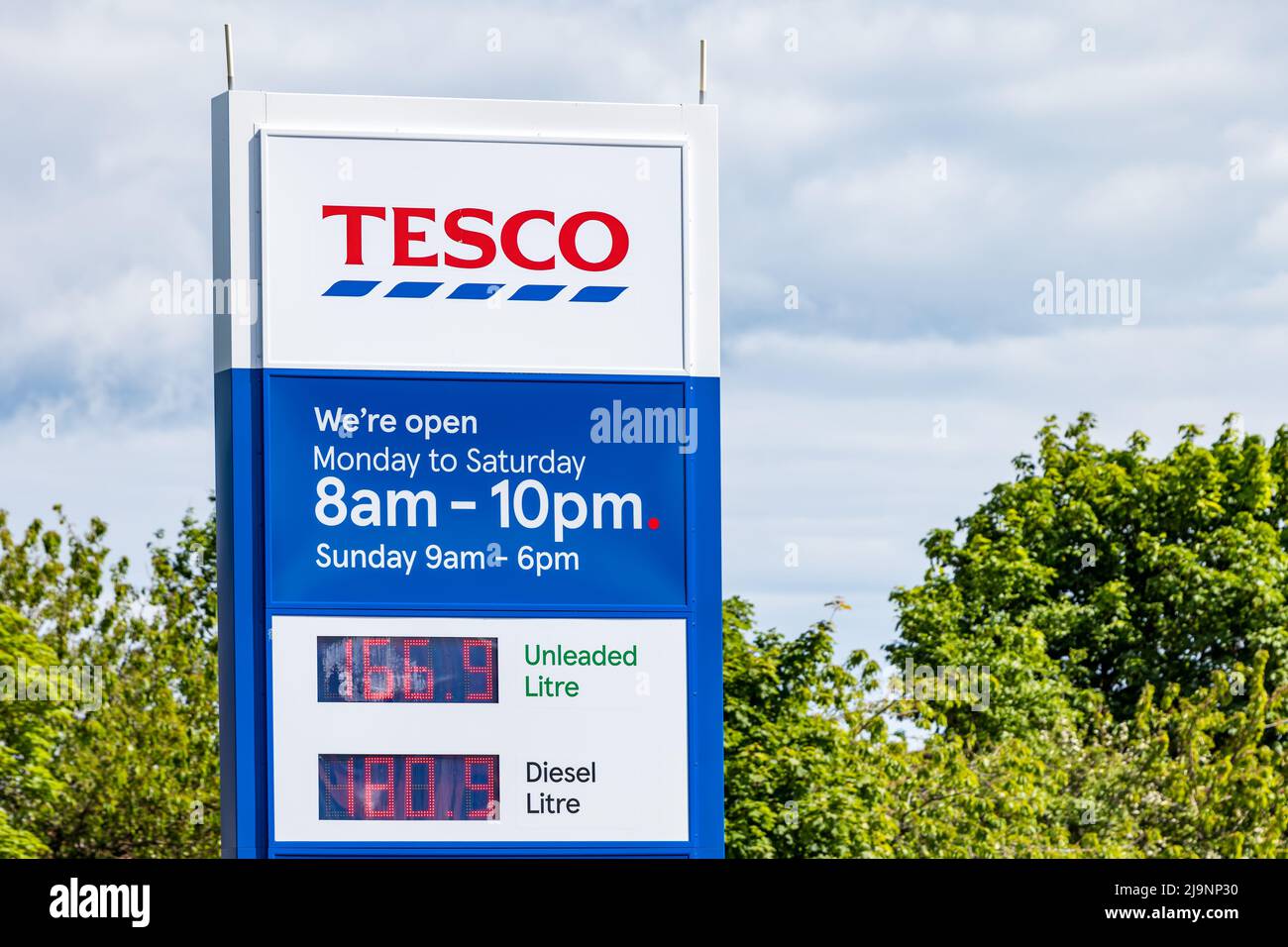 Sign at Tesco supermarket petrol station with fuel prices, North