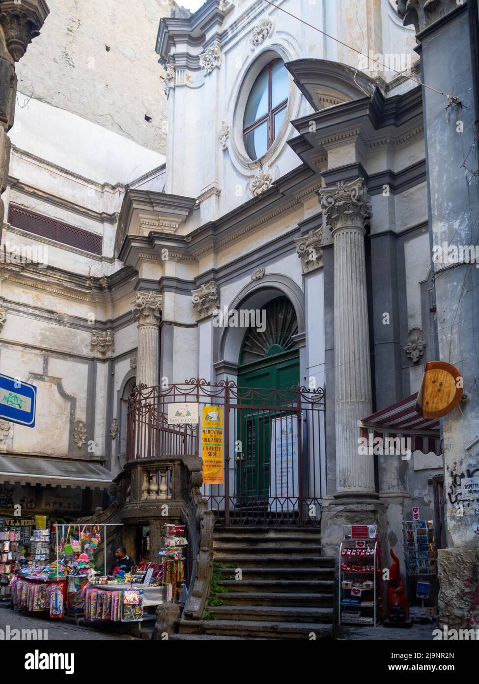 Souvenir shop under San Nicola a Nilo church doorway, Naples Stock Photo