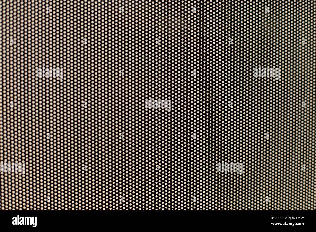 Film on glass of mesh texture. Advertising film from inside interior of bus. Fine grid and blurry background. Stock Photo