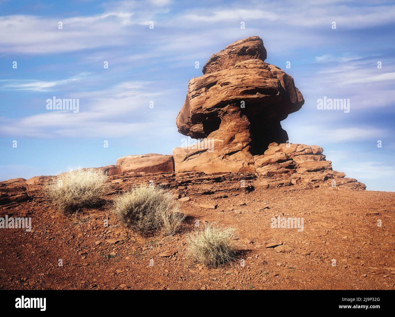 One of the many rock formations that rise above the landscape in Monument Valley, Arizona. Stock Photo