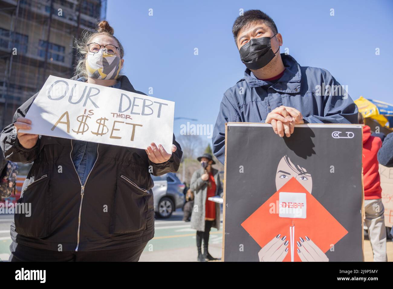 BROOKLYN, N.Y. – April 3, 2021: Demonstrators protest near Grand Army Plaza during a rally to cancel student loan debts. Stock Photo