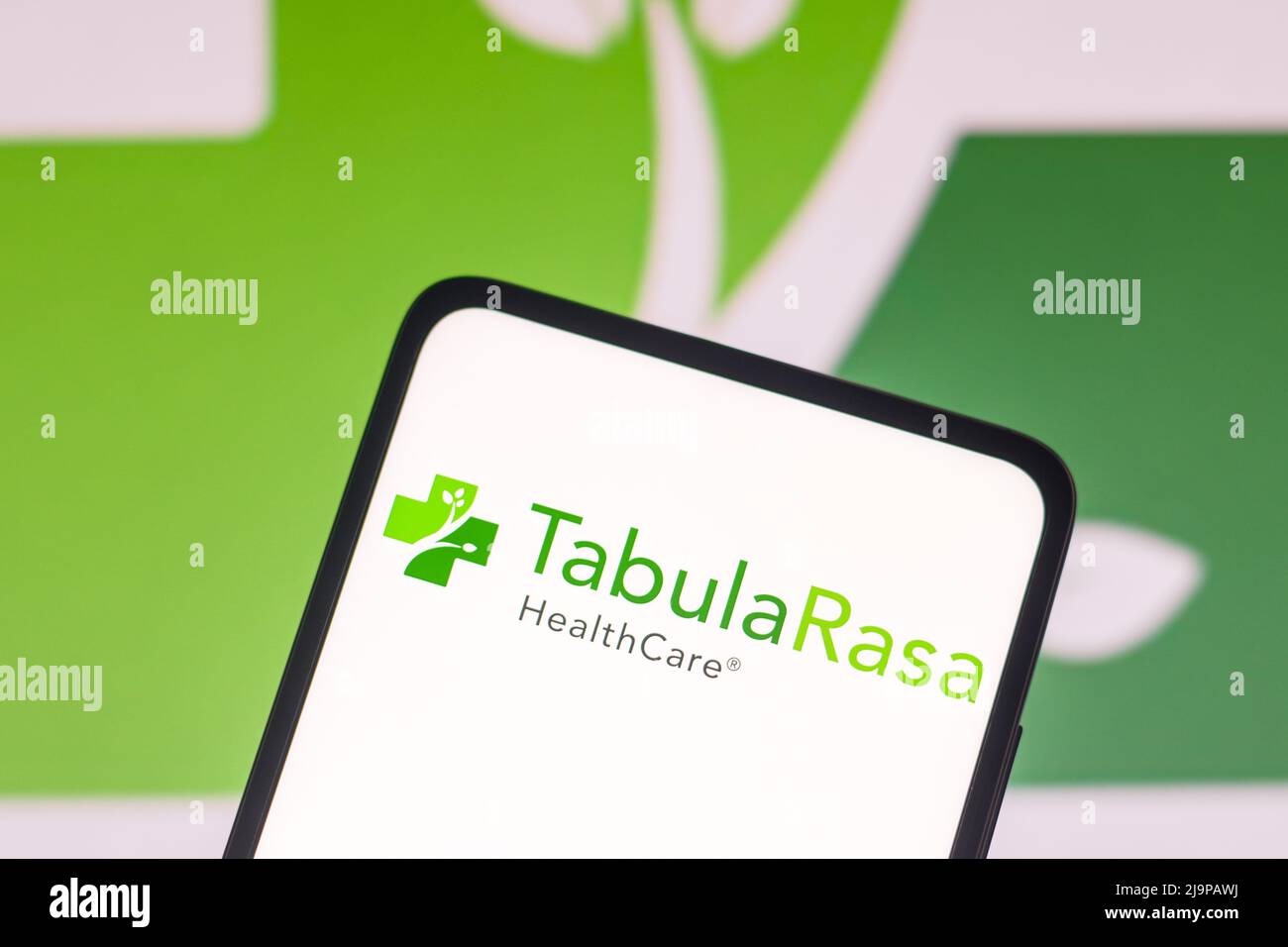 In this photo illustration the Tabula Rasa HealthCare logo seen displayed on a smartphone screen and in the background. Stock Photo