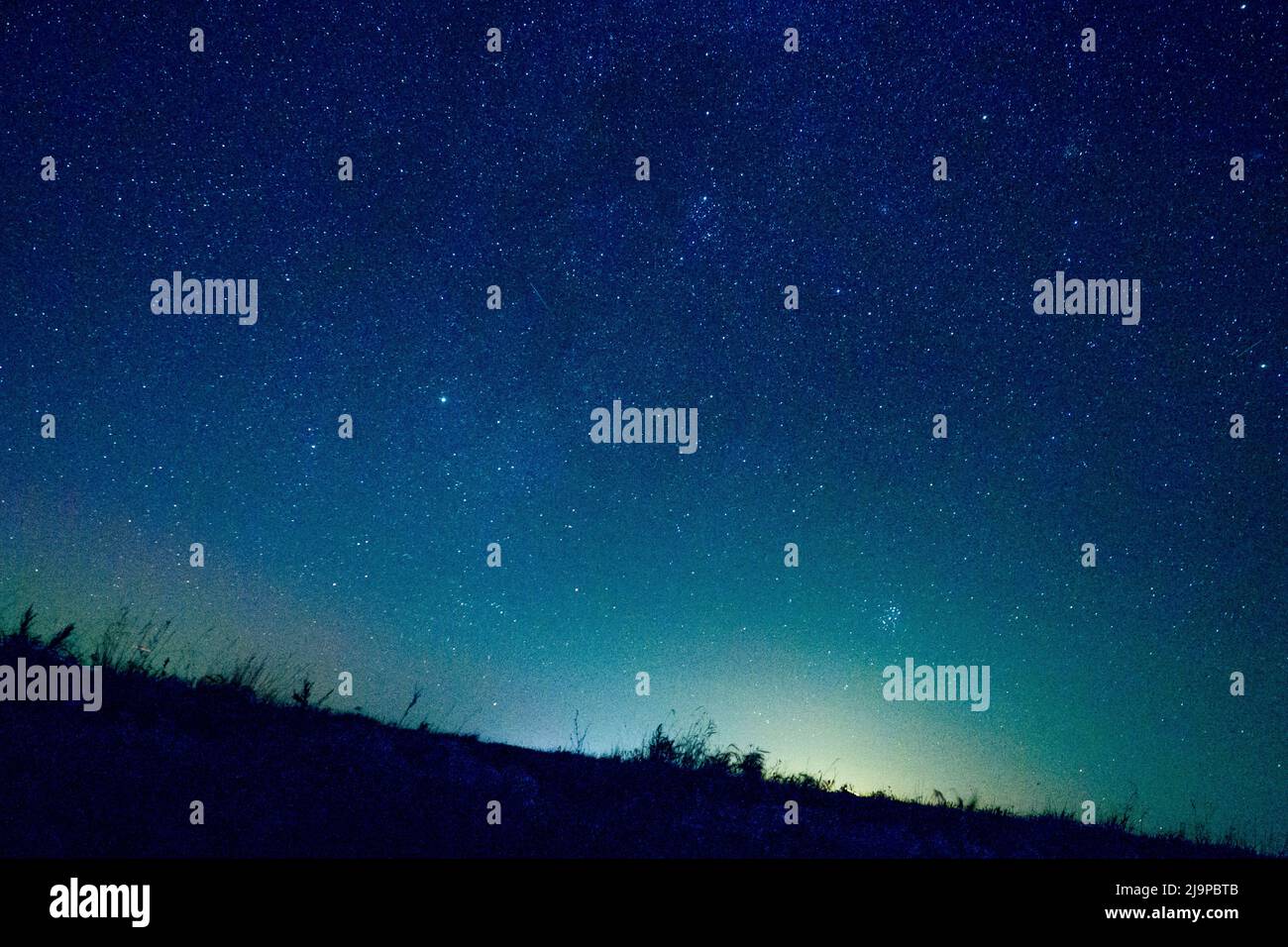 Blue dark night sky with many stars Milkyway cosmos background Stock Photo
