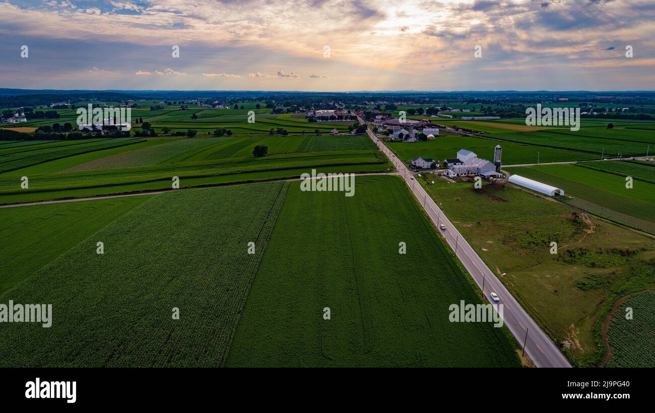 Aerial View of Farmlands With Barns and Silos, Looking Over the Hills ...
