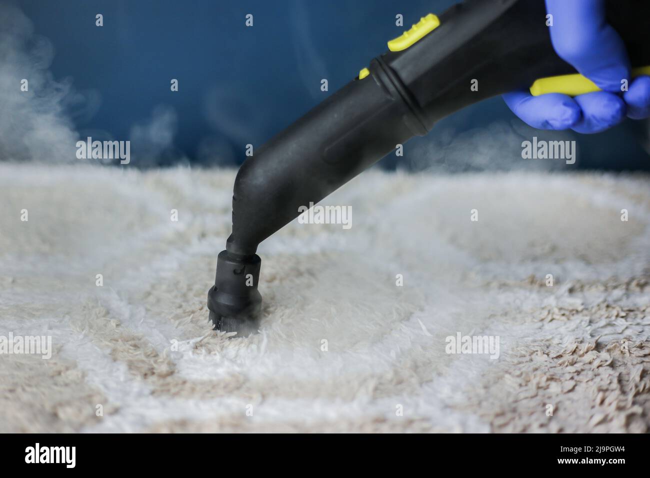 Cleaning and disinfection of a lightcolored carpet with hot steam on
