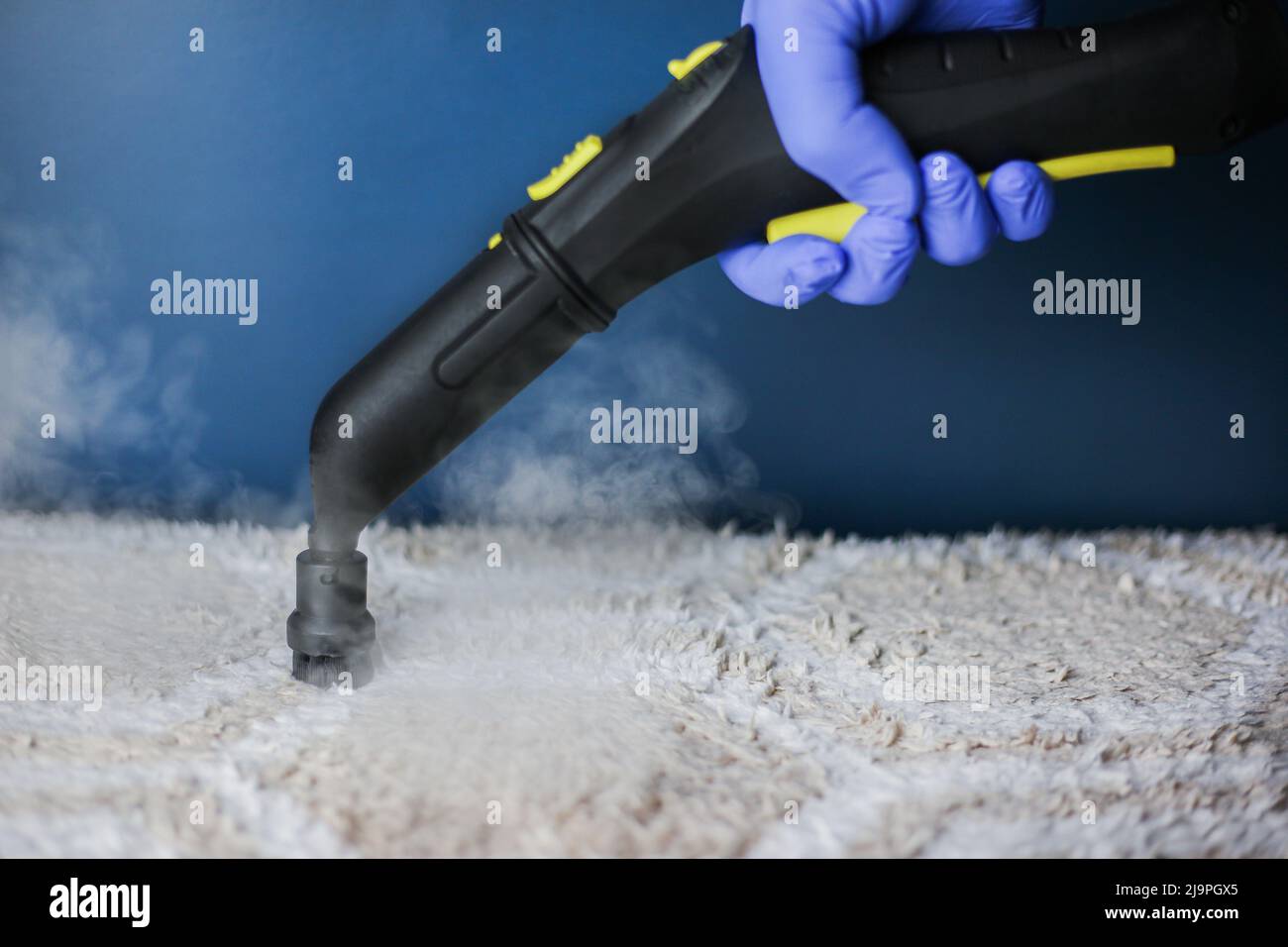 Cleaning and disinfection of a lightcolored carpet with hot steam on