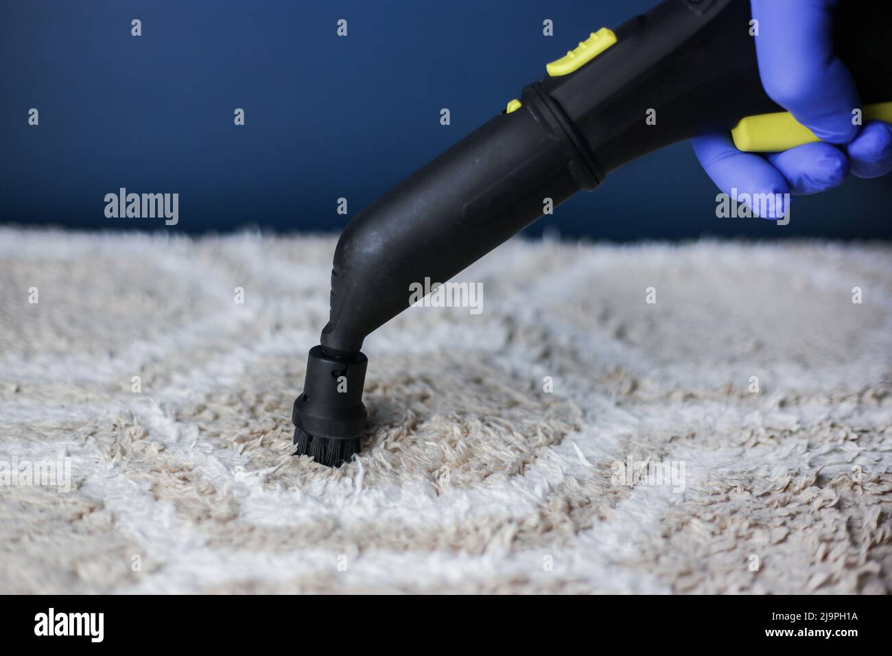 Cleaning and disinfection of a lightcolored carpet with hot steam on