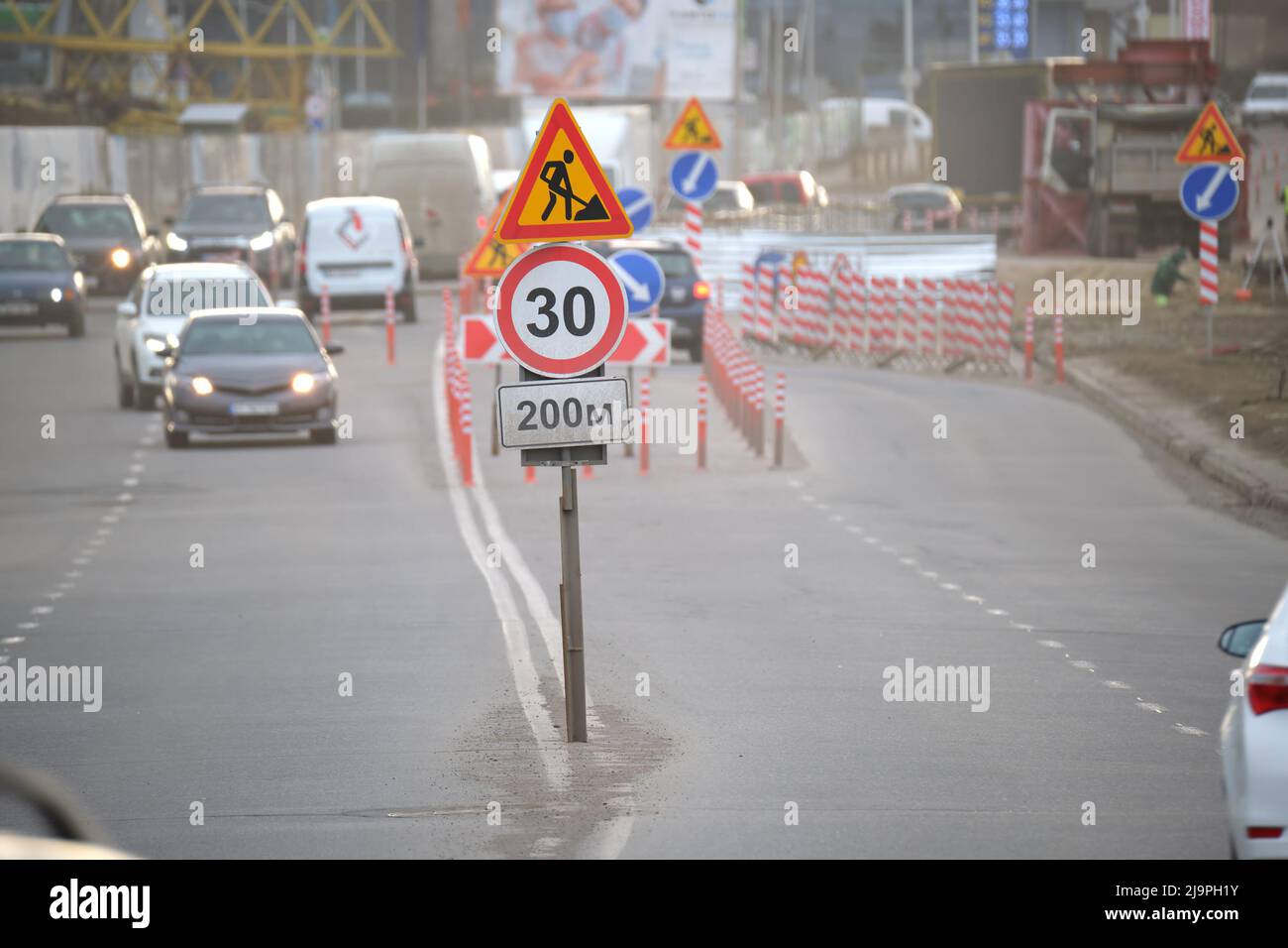Roadworks warning traffic signs of construction work on city street and