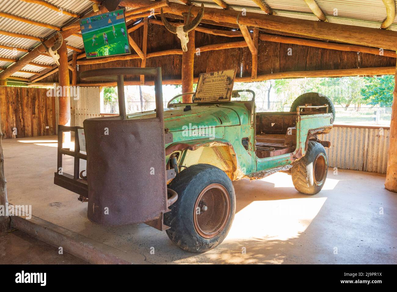 An old Toyota Land Cruiser Bull Catcher used to catch buffalos from the cage in front, Bark Hut Inn, Northern Territory, NT, Australia Stock Photo