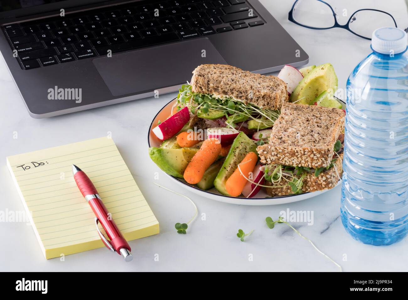 A healthy cape seed bread sandwich served with a side of raw vegetables. Stock Photo