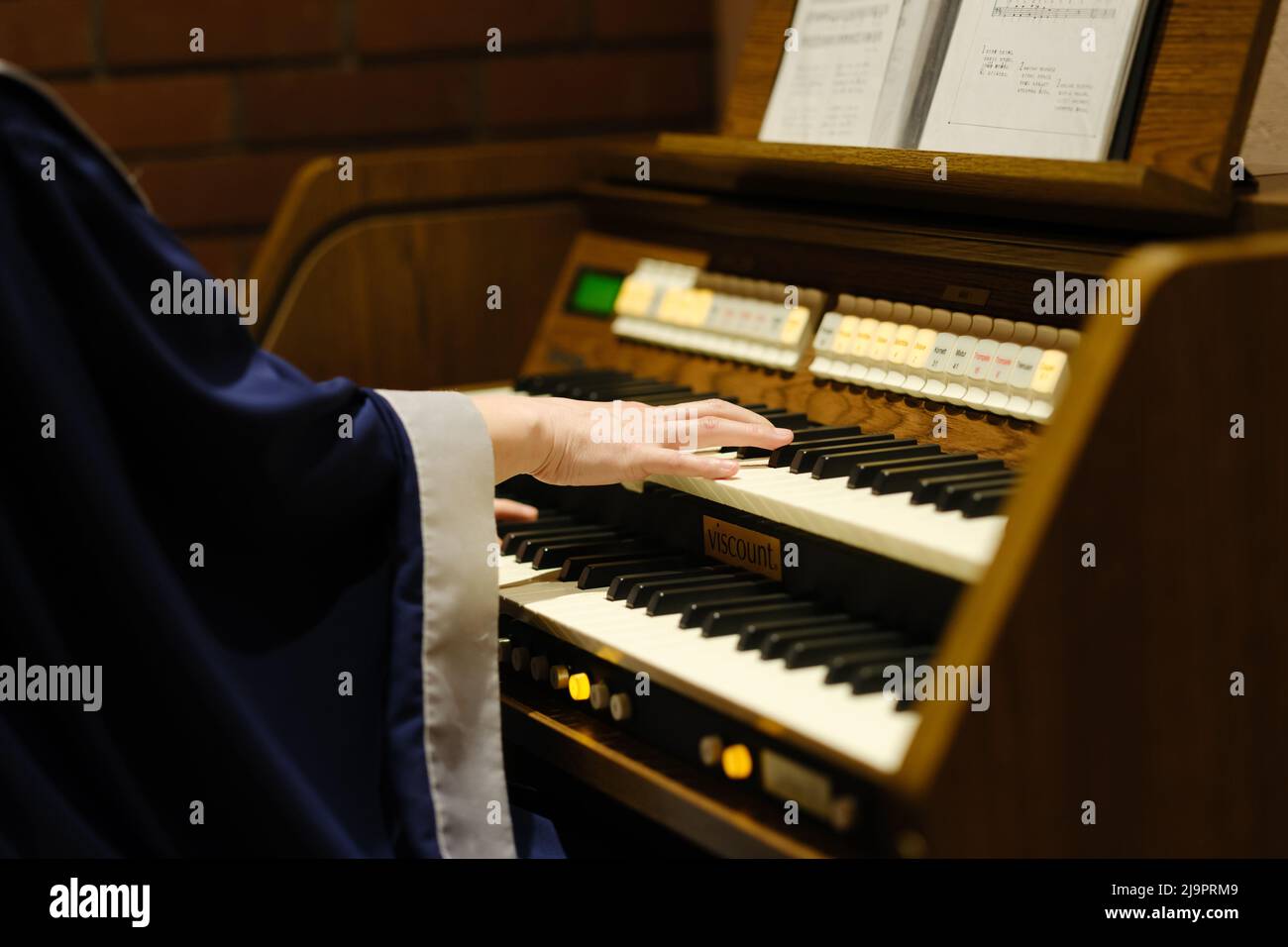 Electronic organ player Stock Photo