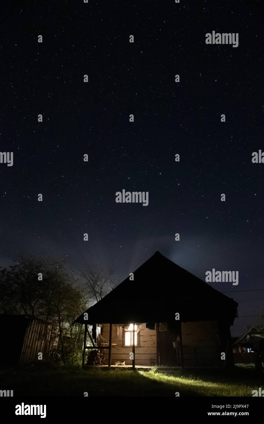 Starry night above illuminated hi-res stock photography and images - Alamy