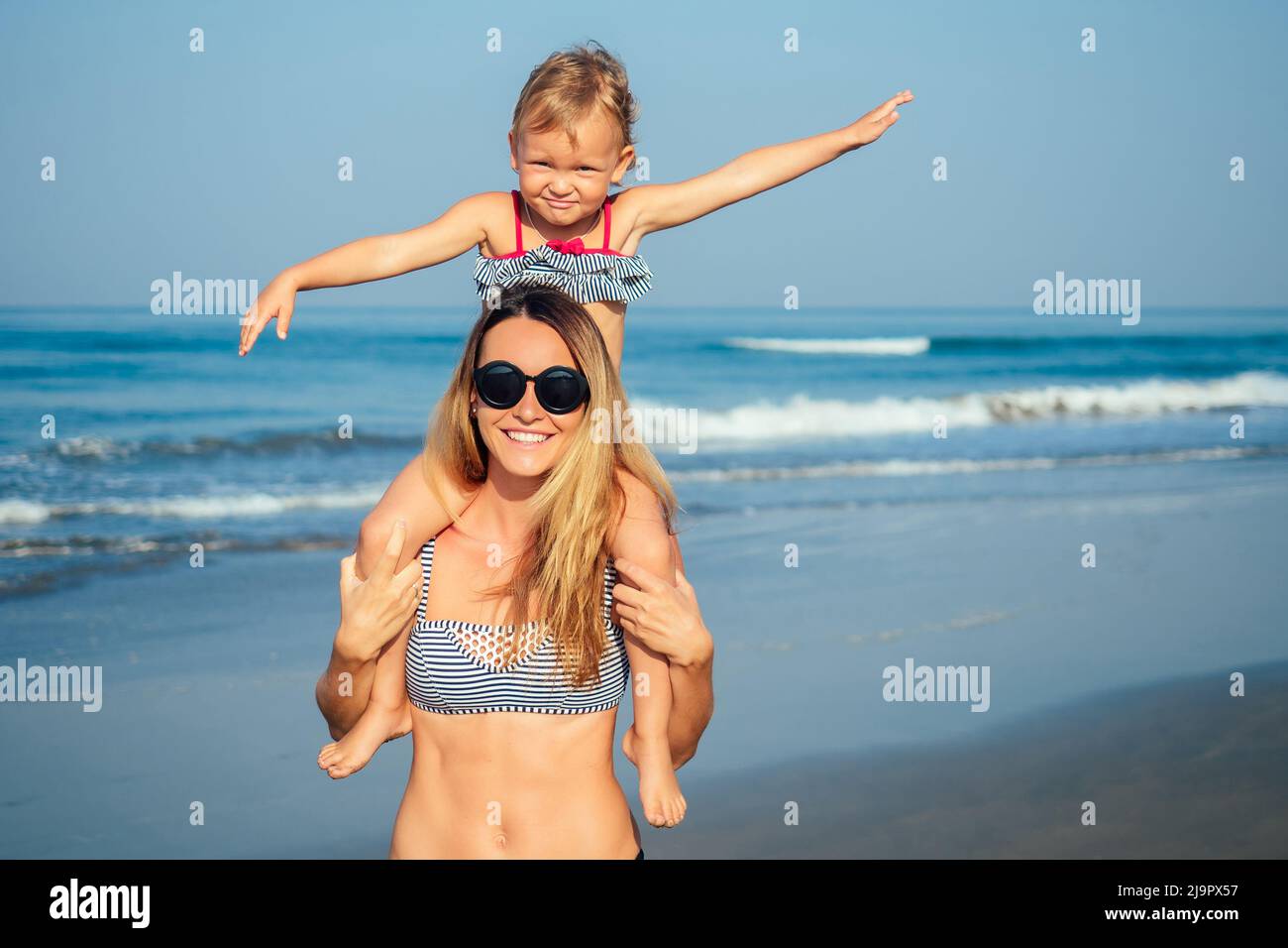 mother daughter having fun resting on the beach Stock Photo