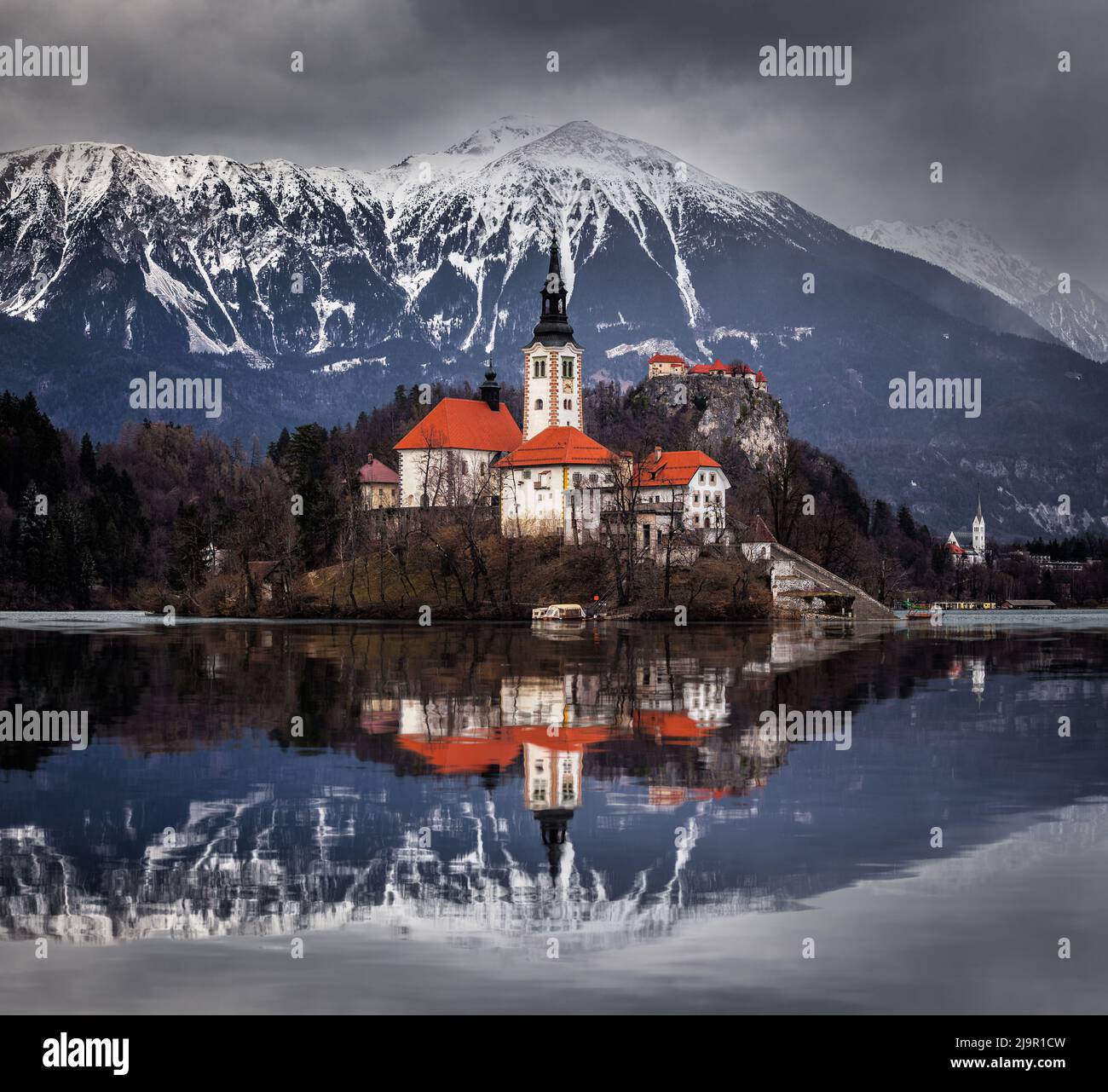 Lake Bled, Slovenia - Beautiful view of Lake Bled (Blejsko Jezero) with reflecting Pilgrimage Church of the Assumption of Maria on Bled Island, Bled C Stock Photo