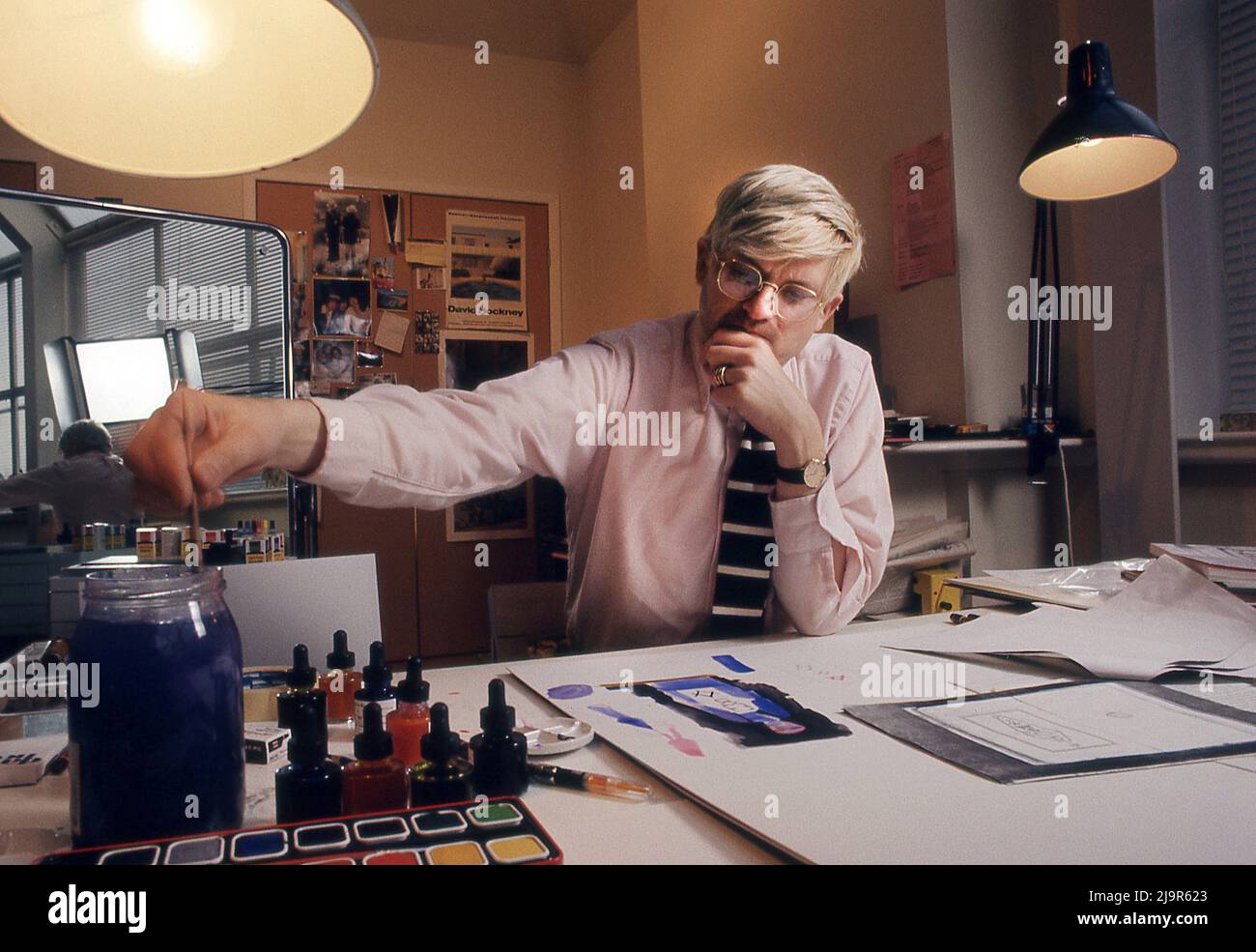 David Hockney working on  set designs for Glyndebourne production of Mozart's the Magic Flute opera in 12/1977 Stock Photo