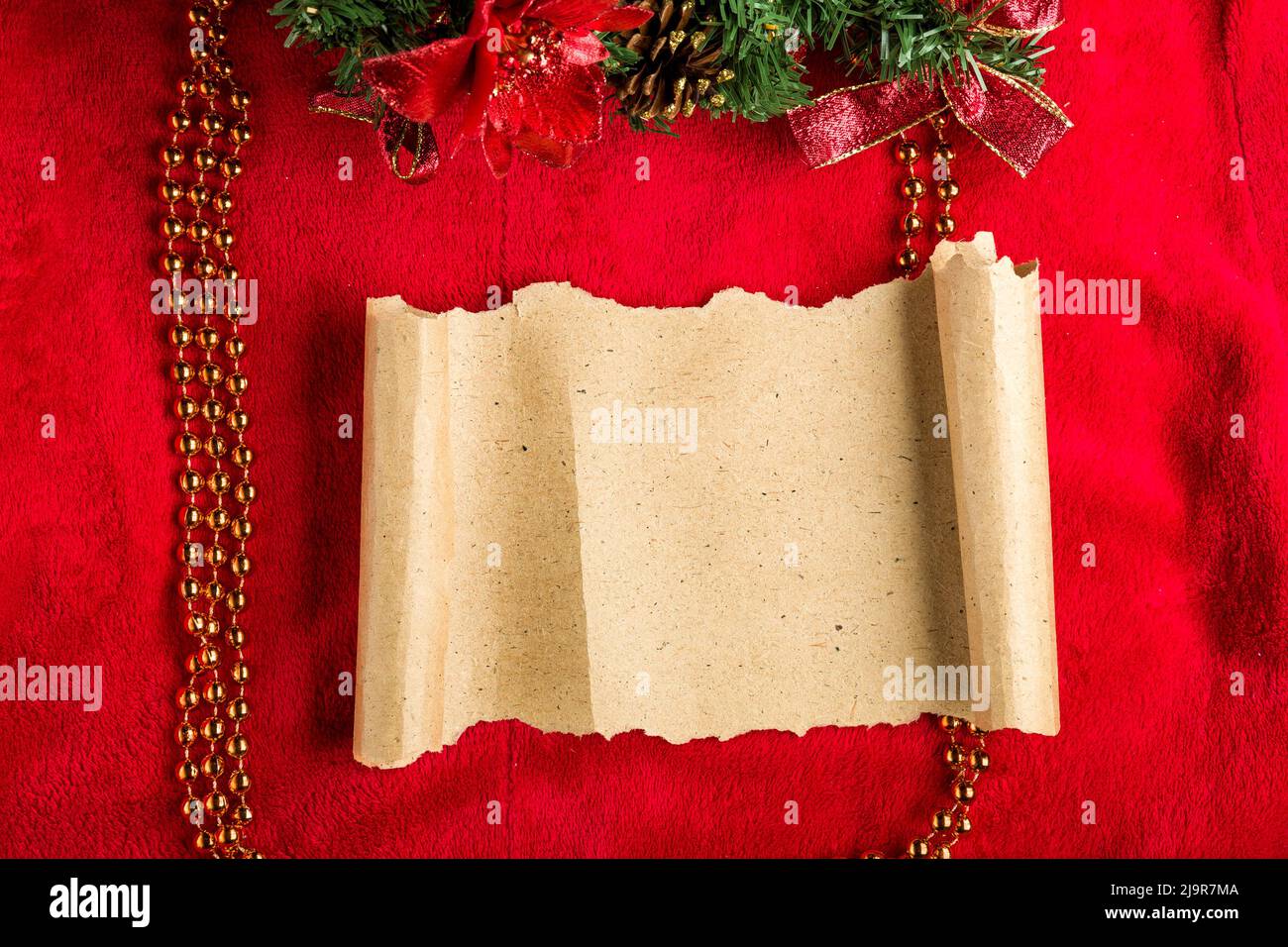 Christmas vintage scroll on red background. Stock Photo