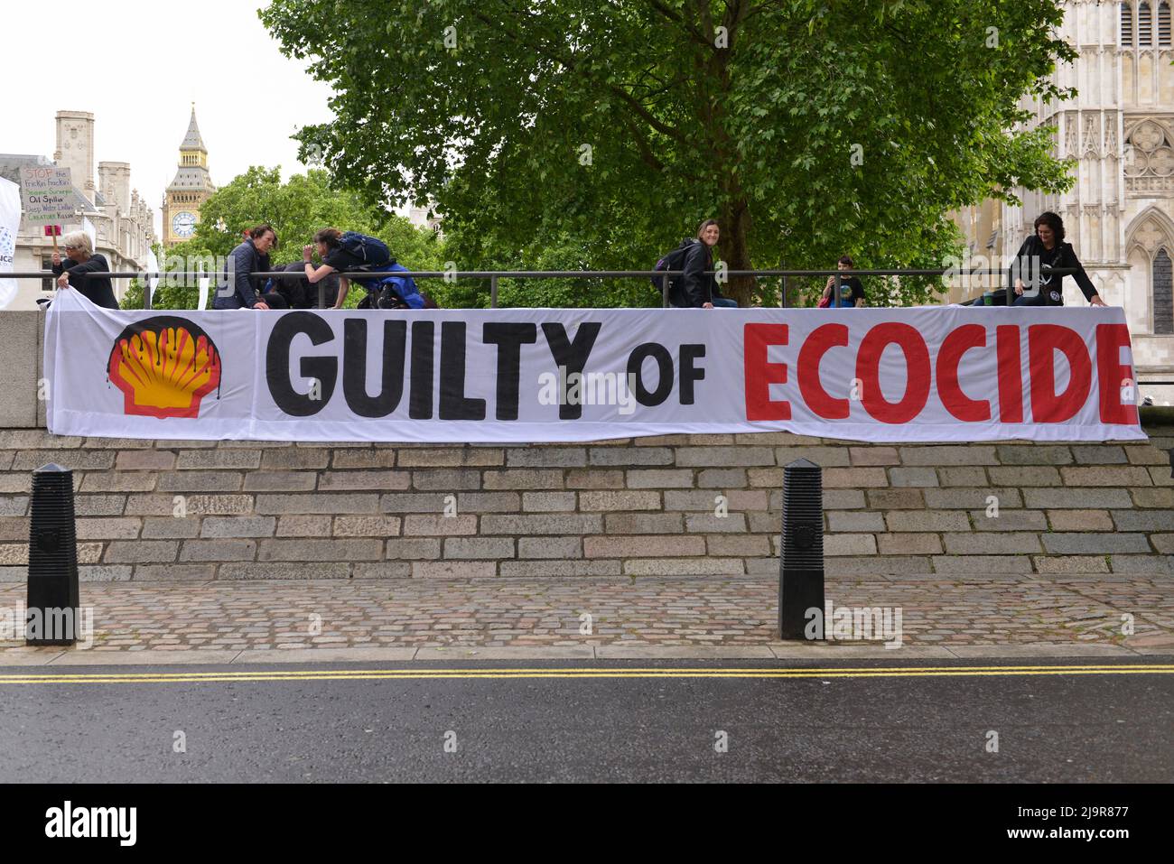 Protesters hold banner at the demonstration. Extinction Rebellion protesters gathered at Methodist Central Hall Westminster in London, to stop Shell Annual General Meeting. Stock Photo