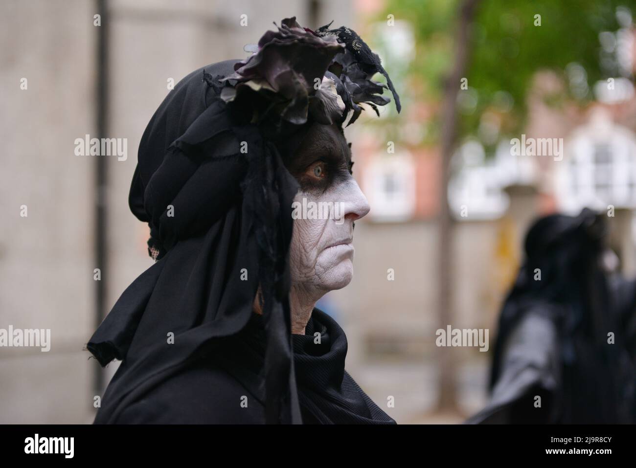 Member of The Black Rebels from Extinction Rebellion seen at the rally. Extinction Rebellion protesters gathered at Methodist Central Hall Westminster in London, to stop Shell Annual General Meeting. Stock Photo