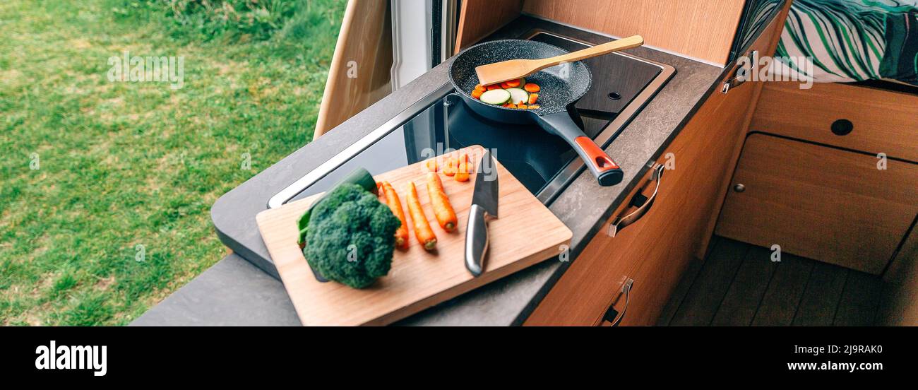 Vegan meal preparation in a campervan Stock Photo