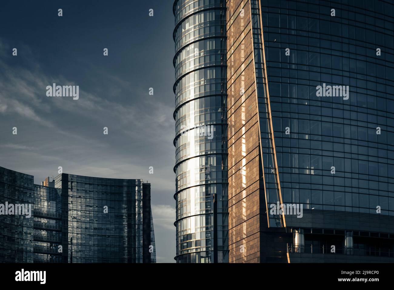 Modern and minimal architecture made by steel and glass. Skyscrapers reflecting the sunlight. Stock Photo