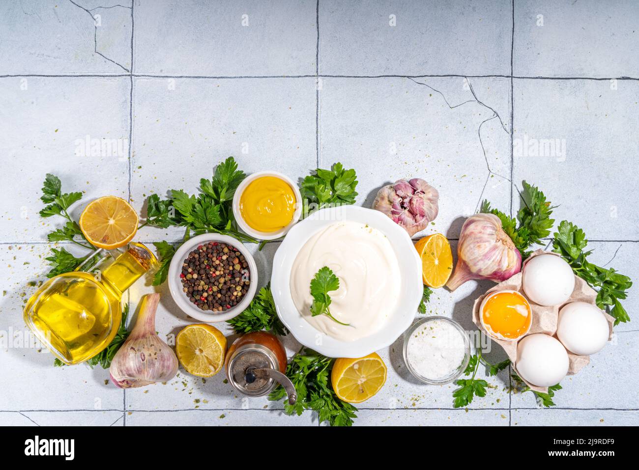 Homemade mayonnaise sauce. Bowl of mayonnaise with fresh ingredients