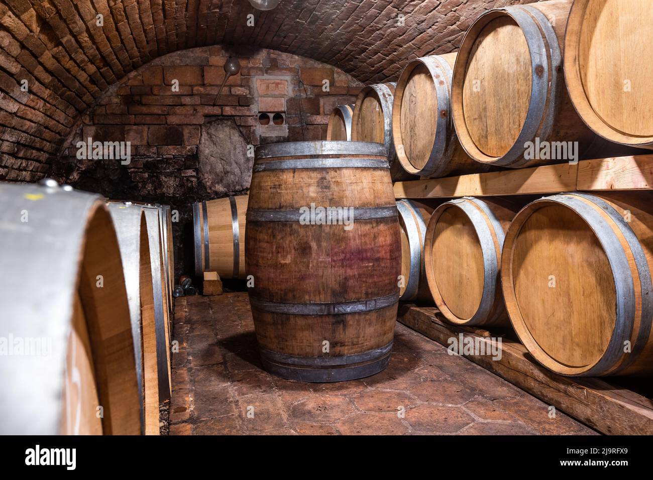 A wine cellar full of barrels of wine, alcohol concept Stock Photo Alamy