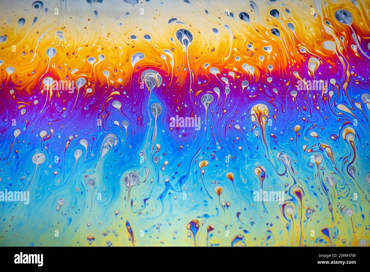 Abstract pattern of refracted light in soap bubble. Stock Photo