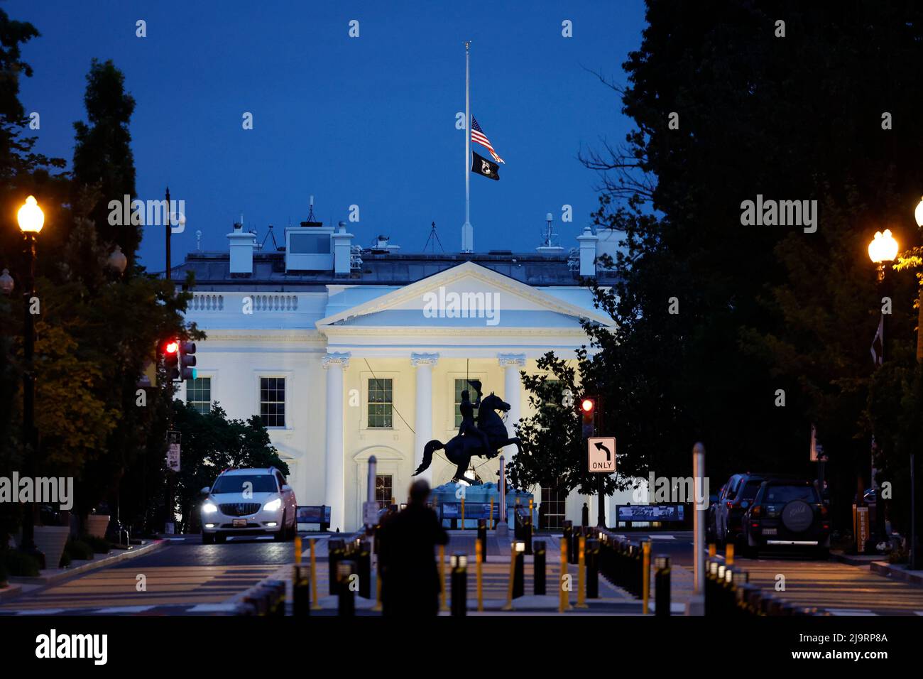 Washington, USA. 24th May, 2022. The U.S. flag flies at half-staff on top of the White House in Washington, DC, the United States, on May 24, 2022. At least 19 children and two adults were killed in a shooting at Robb Elementary School in the town of Uvalde, Texas, on Tuesday. Credit: Ting Shen/Xinhua/Alamy Live News Stock Photo